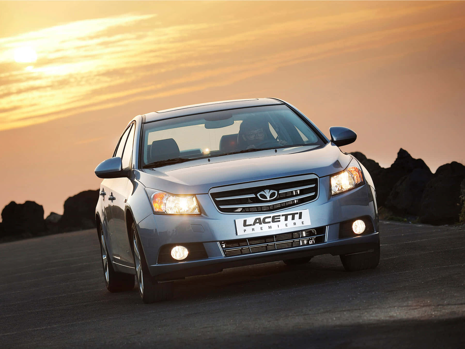 Caption: Sleek Daewoo Lacetti Cruising On The Road Wallpaper