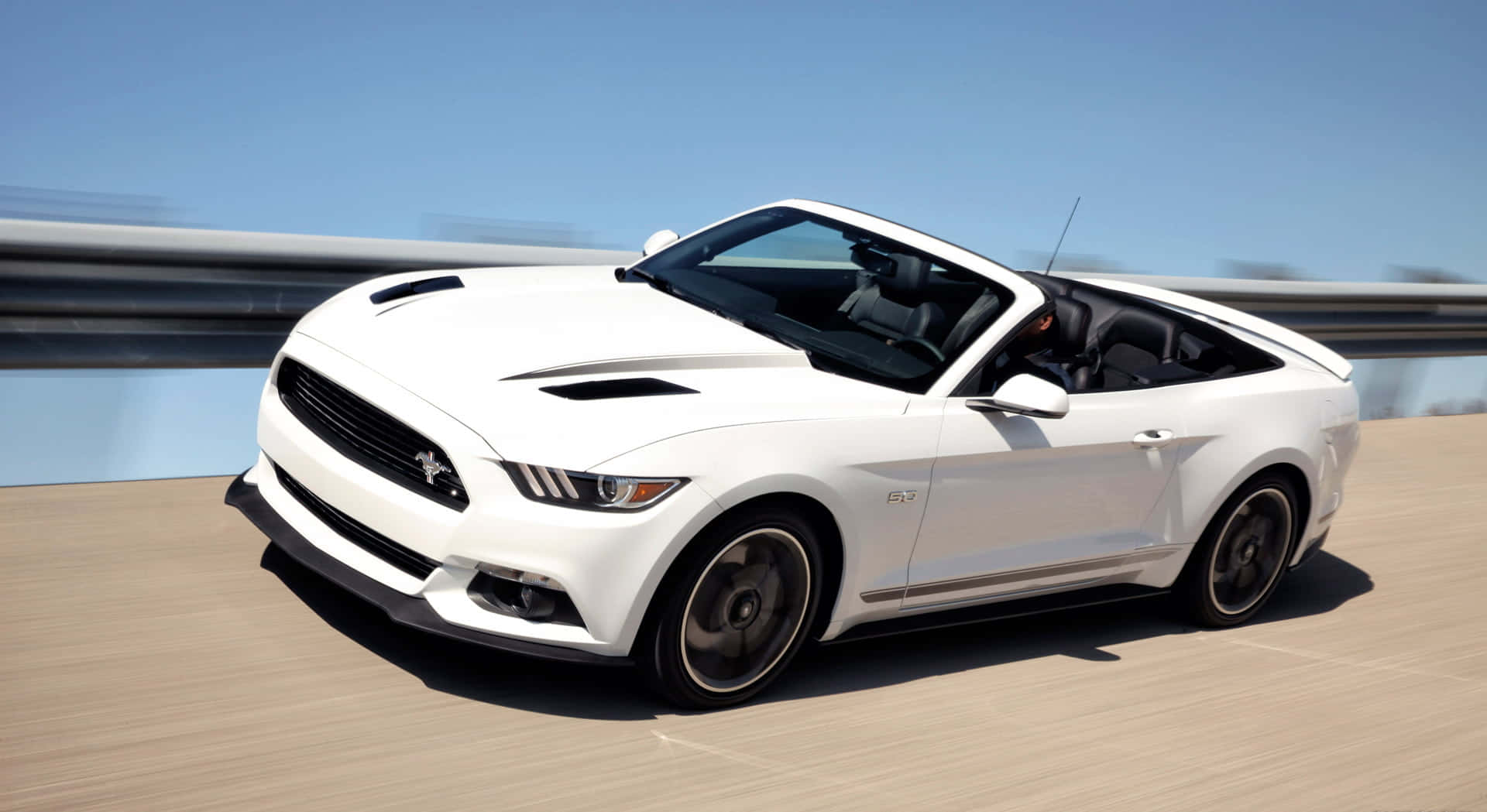 Caption: Sleek Ford Mustang Gt Convertible Cruising On The Highway Wallpaper