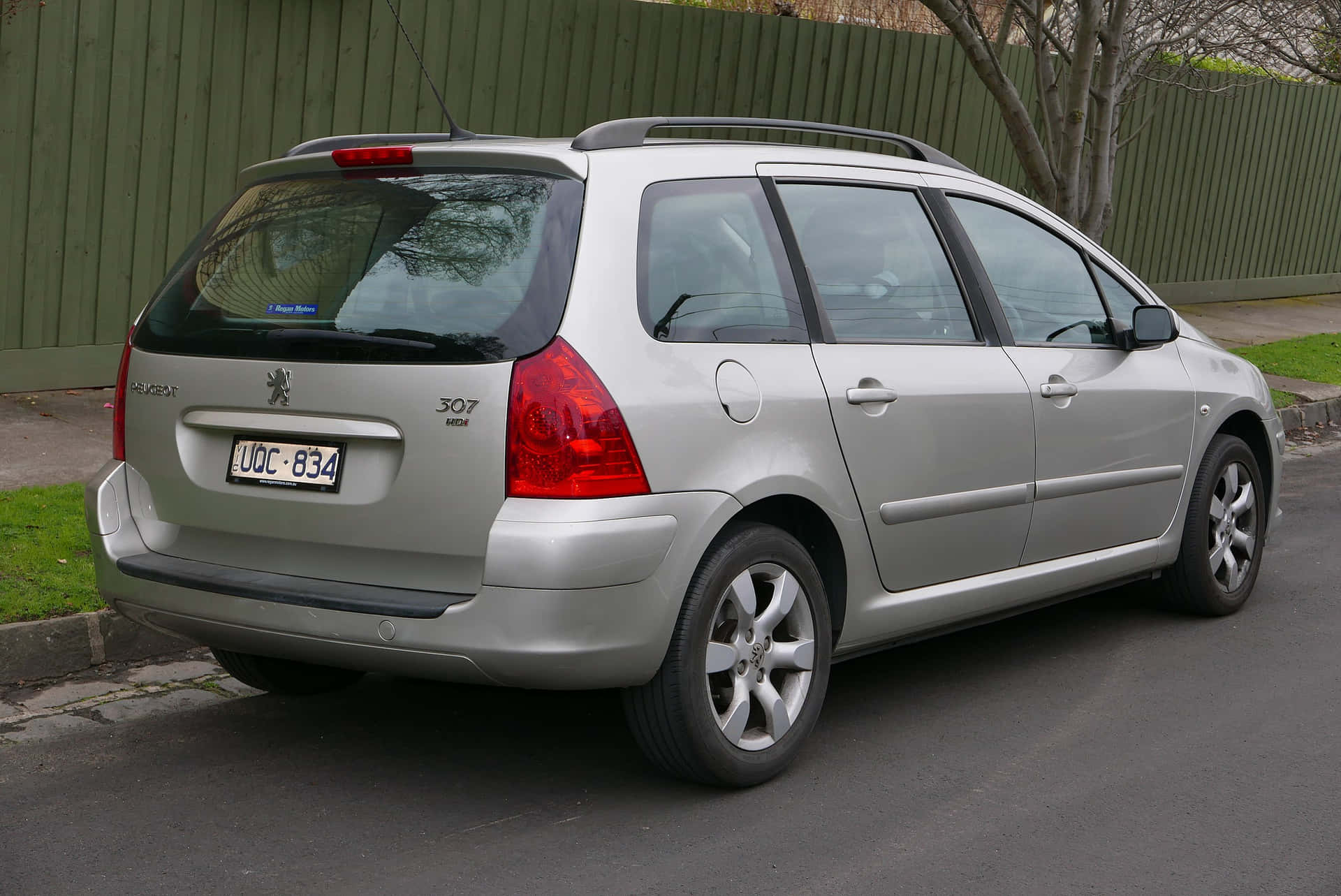 Caption: Sleek Peugeot 307 In Stunning Cityscape Background Wallpaper