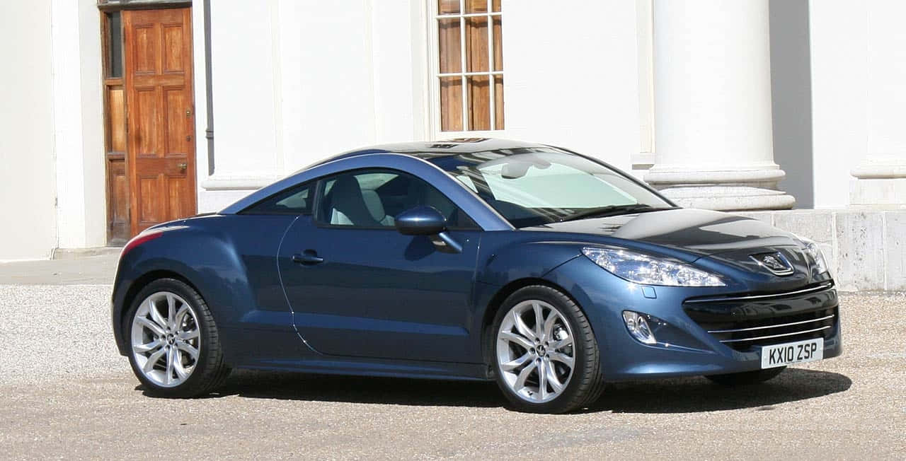 Bildetekst: Sleek Peugeot Rcz Cruiser På En Åpen Vei Bakgrunnsbildet