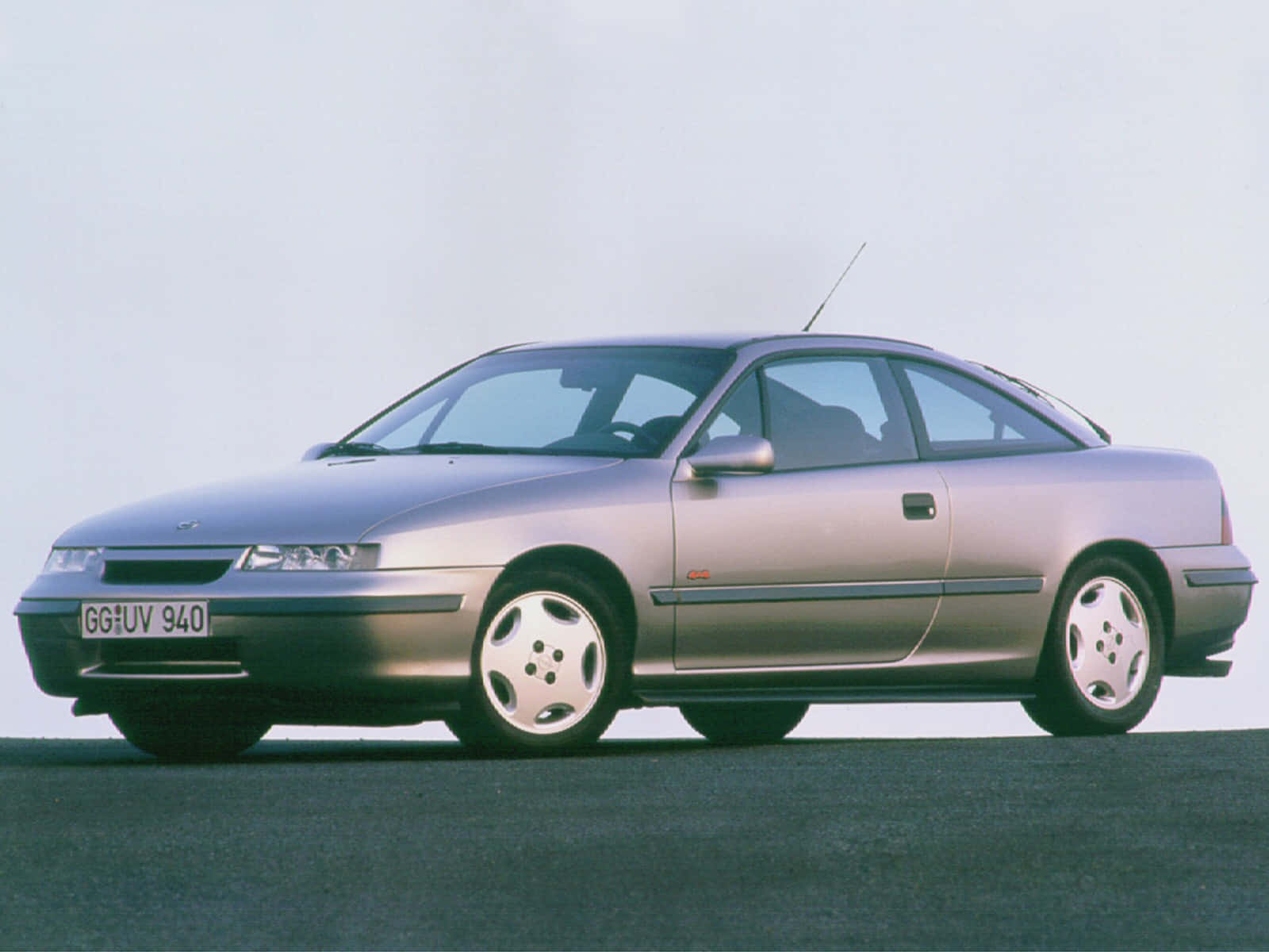 Caption: Sleek Red Opel Calibra In Full Glory Wallpaper