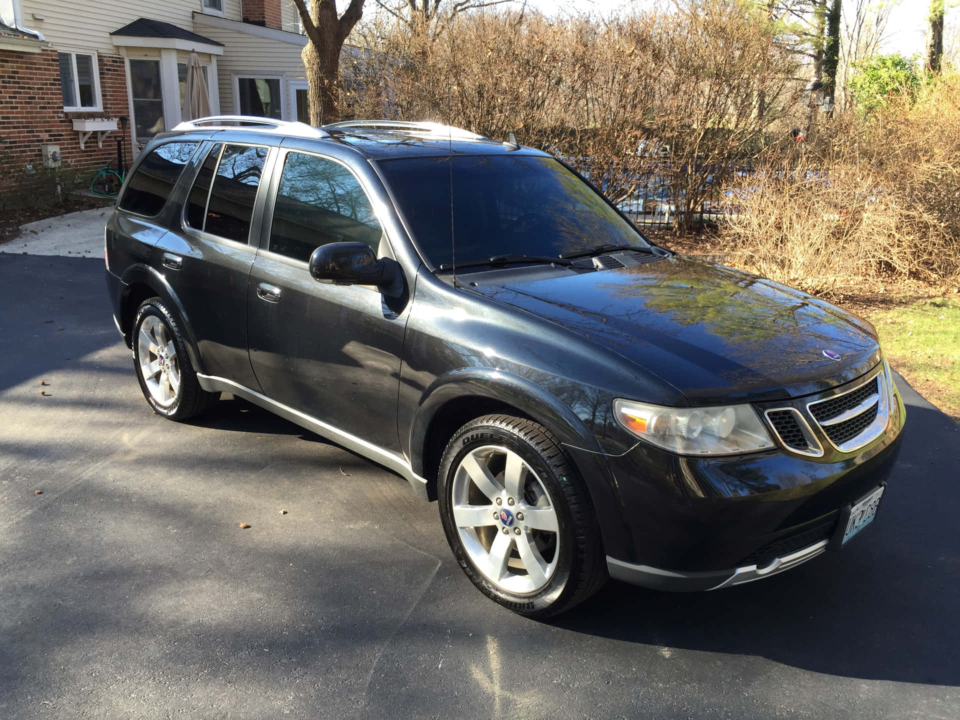 Caption: Sleek Saab 9-7x Luxurious Suv On A Scenic Landscape Wallpaper