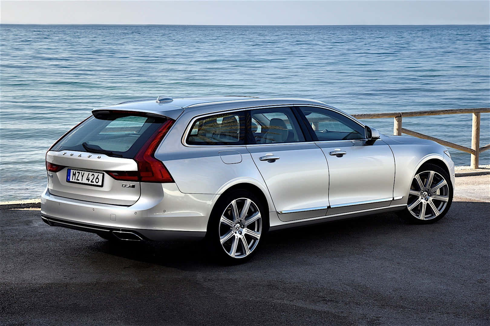 Caption: Sleek Sophistication - Volvo V90 In Scenic Mountain View Wallpaper