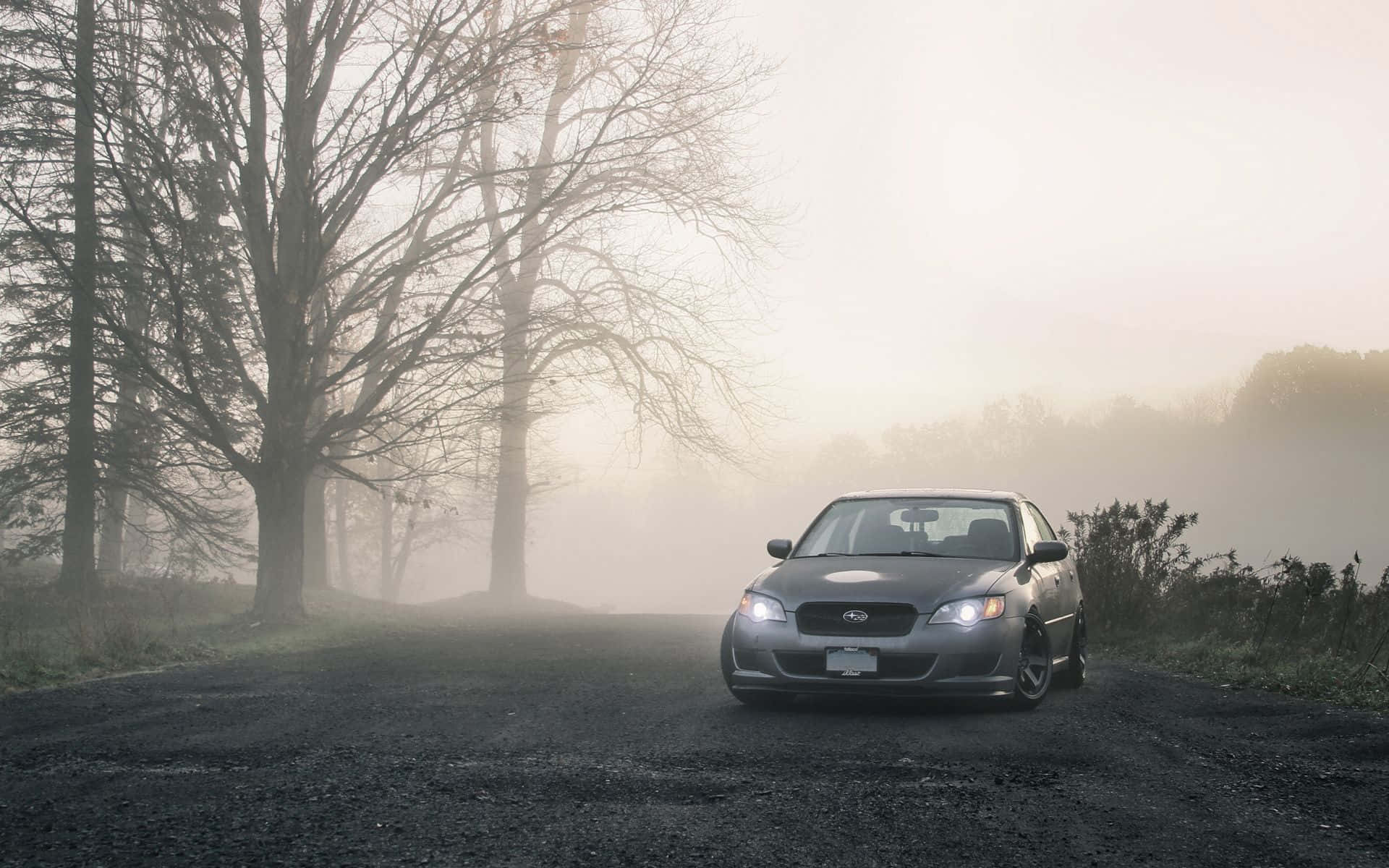 Caption: Sleek Subaru Legacy 2022 Cruising On A Highway Wallpaper