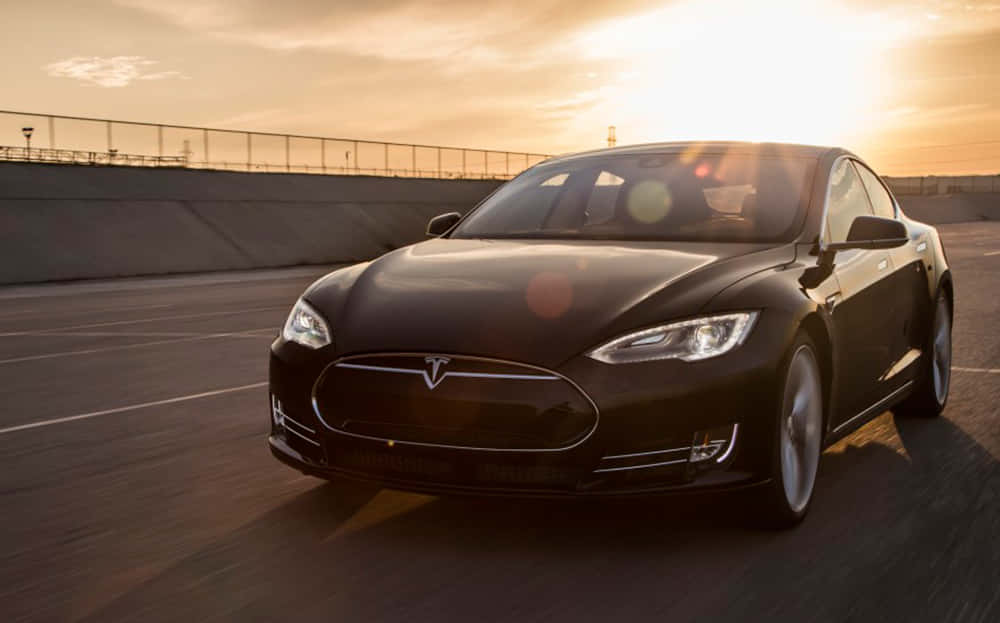 Caption: Sleek Tesla Model S In Action Wallpaper