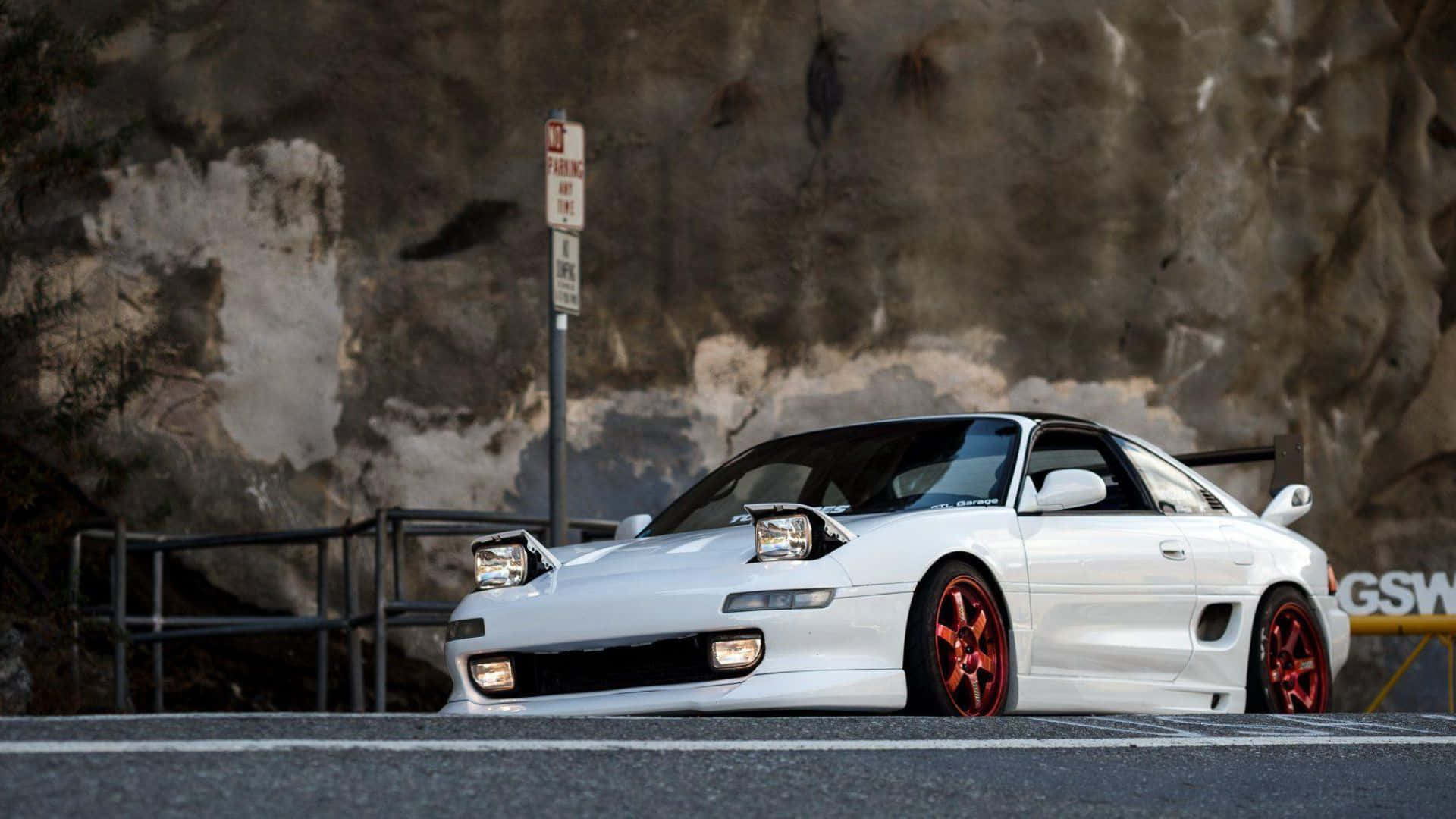 Caption: Sleek Toyota Mr2 Gliding On Open Road Wallpaper