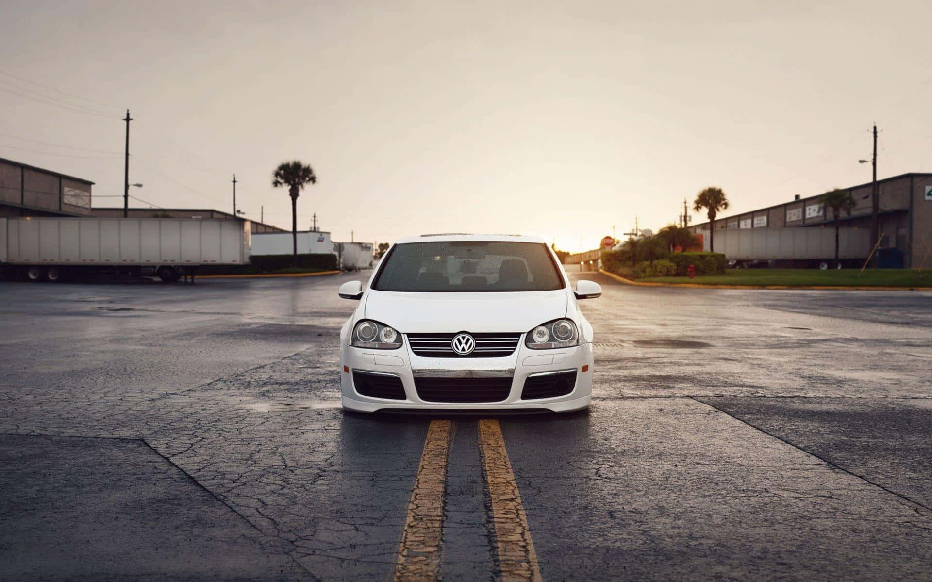 Caption: Sleek Volkswagen Golf In Urban Environment Wallpaper