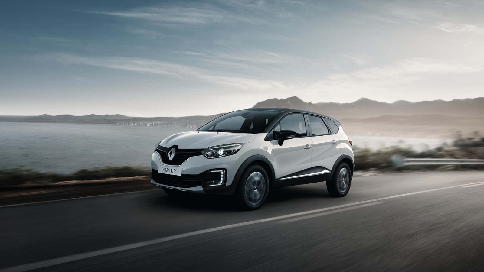 Caption: Smooth Drive With A Renault Captur Wallpaper