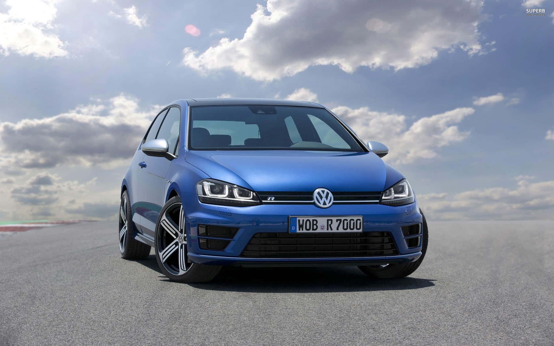 Caption: Sporty Elegance: 2022 Volkswagen Golf Gti On The Runway Wallpaper