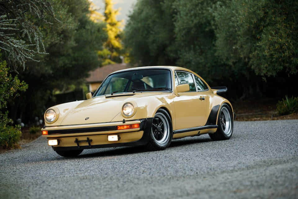 Caption: Stunning Porsche 930 Turbo In Full Throttle Wallpaper