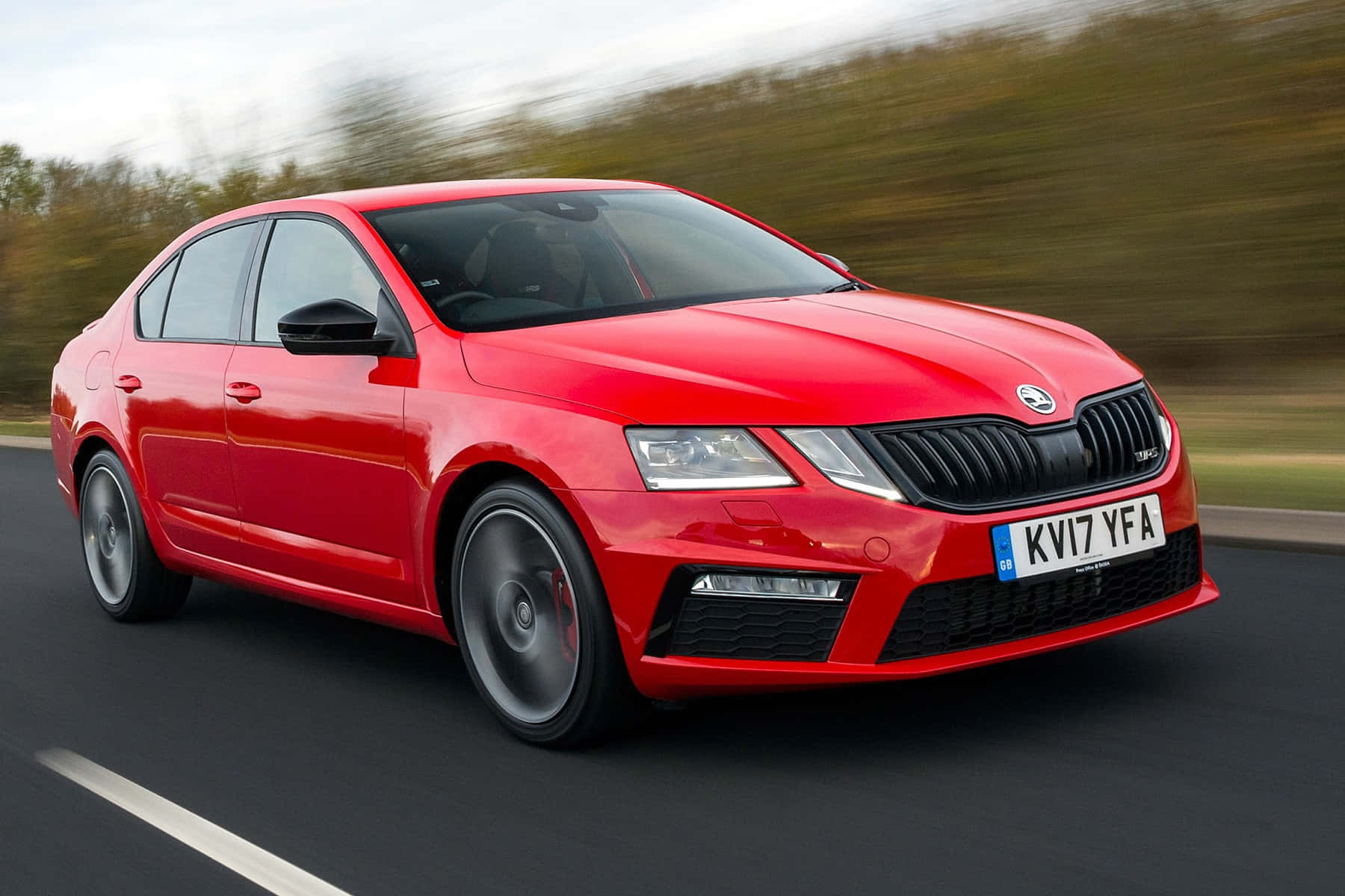 Caption: Stunning Skoda Octavia In Vibrant Setting Wallpaper