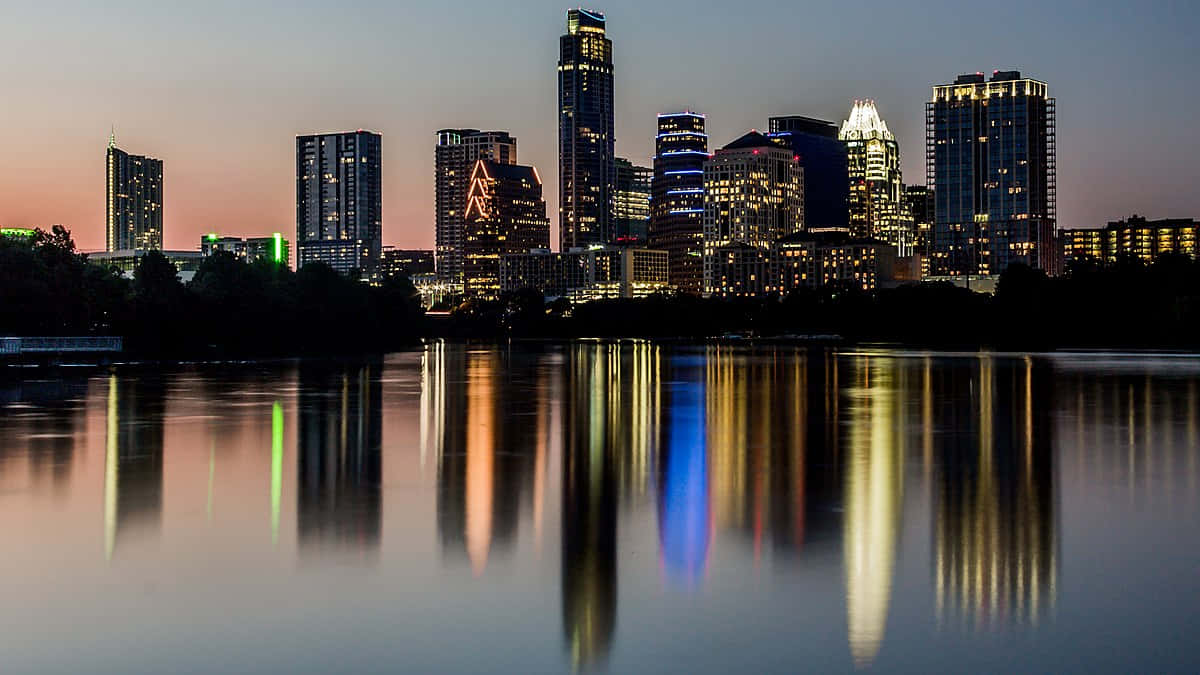 Caption: Stunning Sunset View Of Austin Cityscape Wallpaper