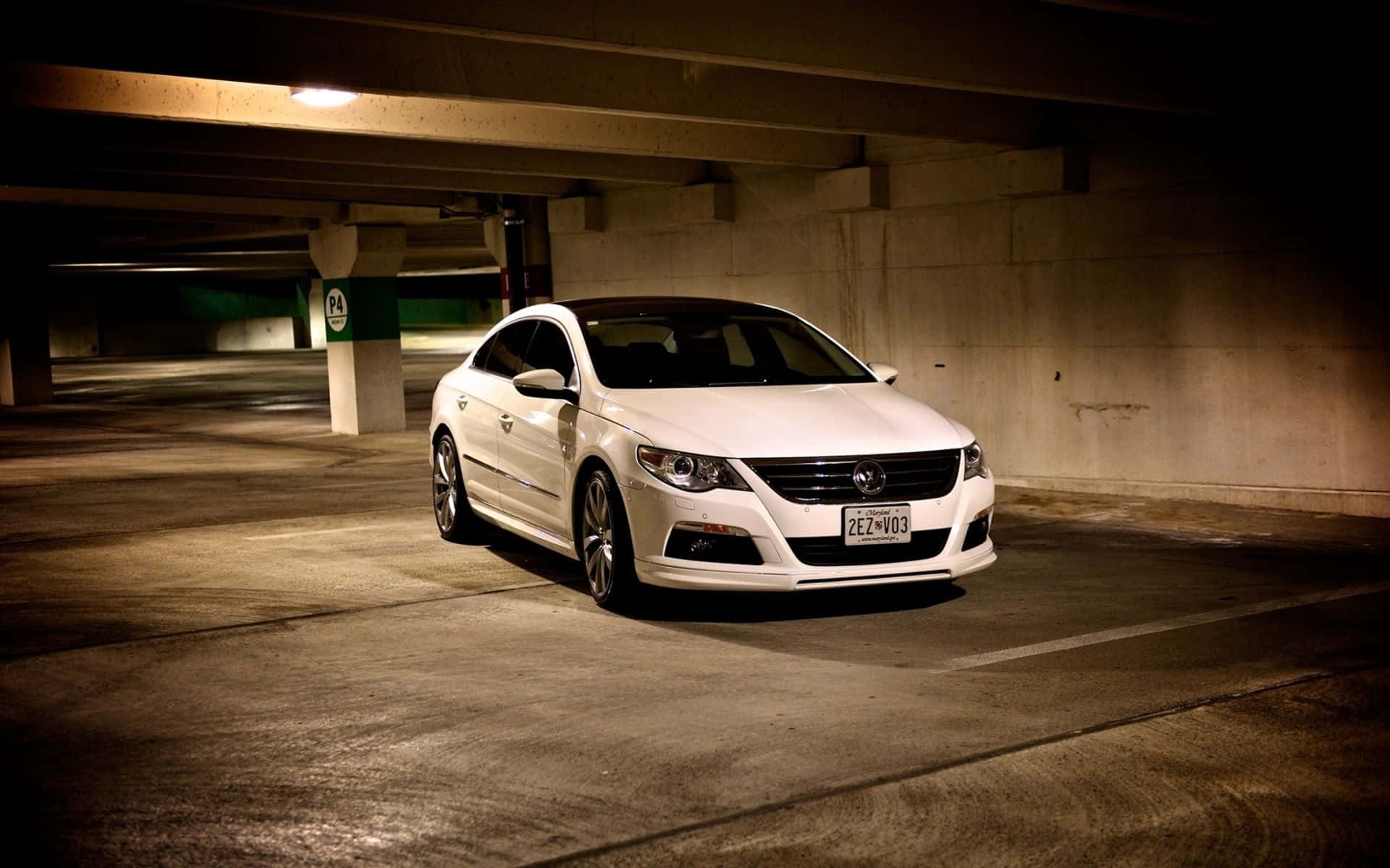 Caption: Stunning Volkswagen Passat Cc Under A Starry Sky Wallpaper