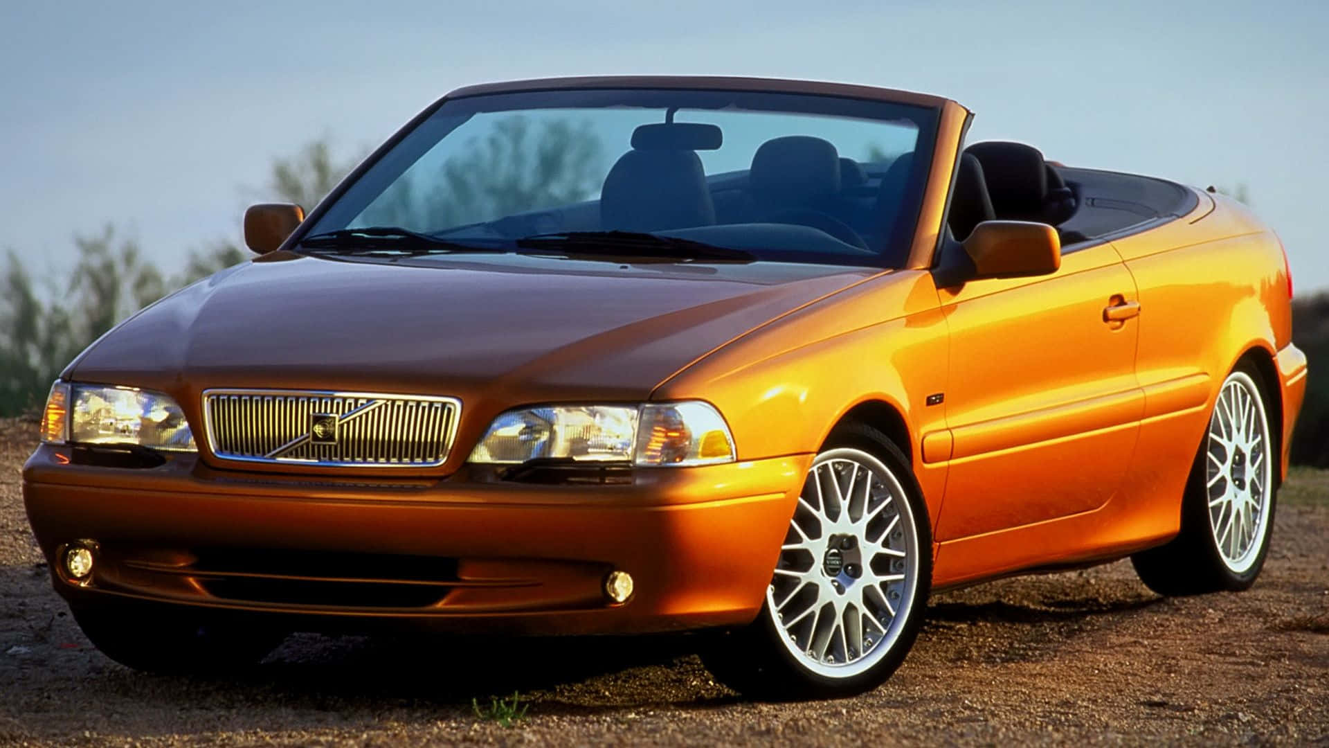 Caption: Stunning Volvo C70 In The Glow Of Sunset Wallpaper