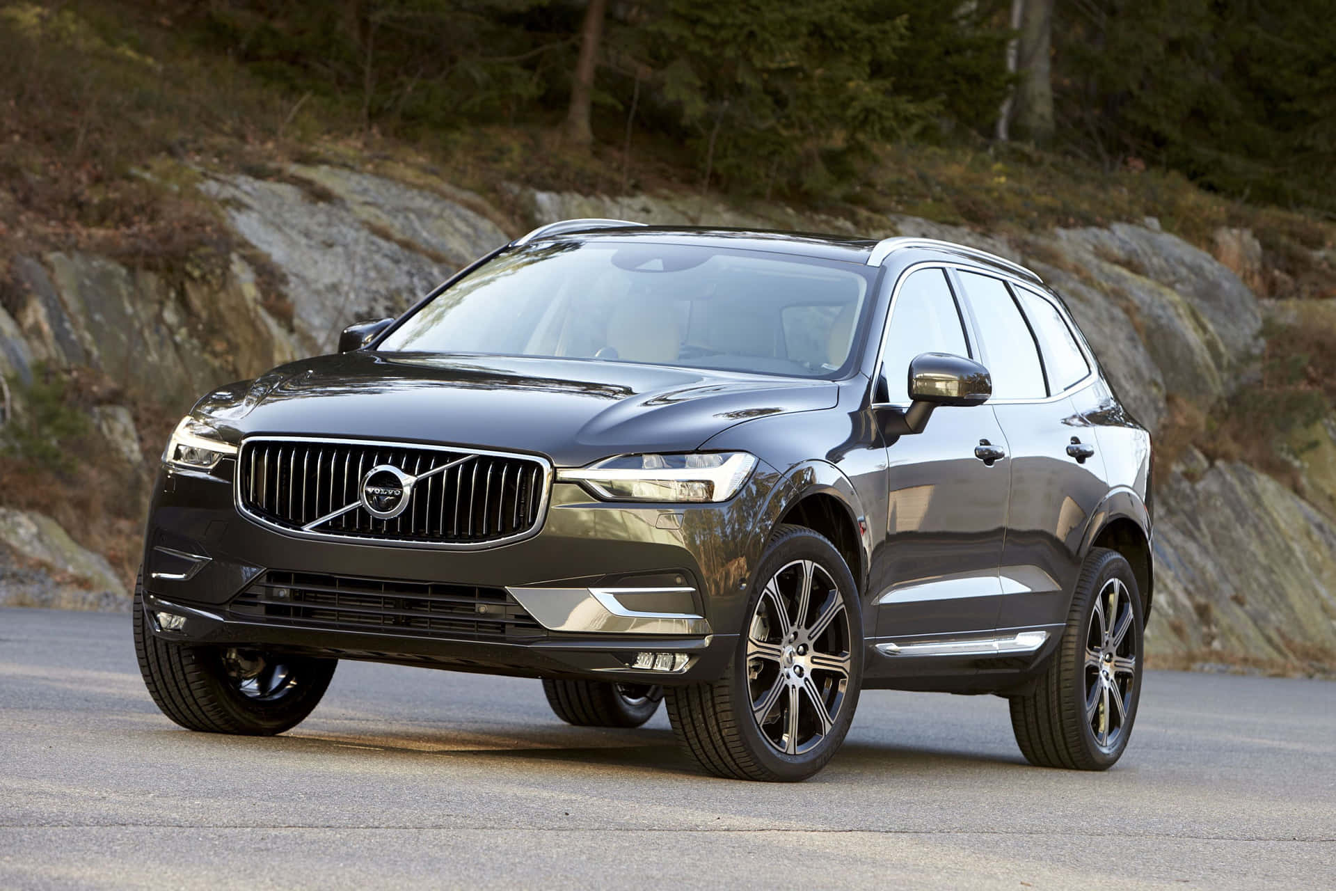 Caption: Stunning Volvo Xc60 Parked Outdoors Against A Serene Backdrop Wallpaper