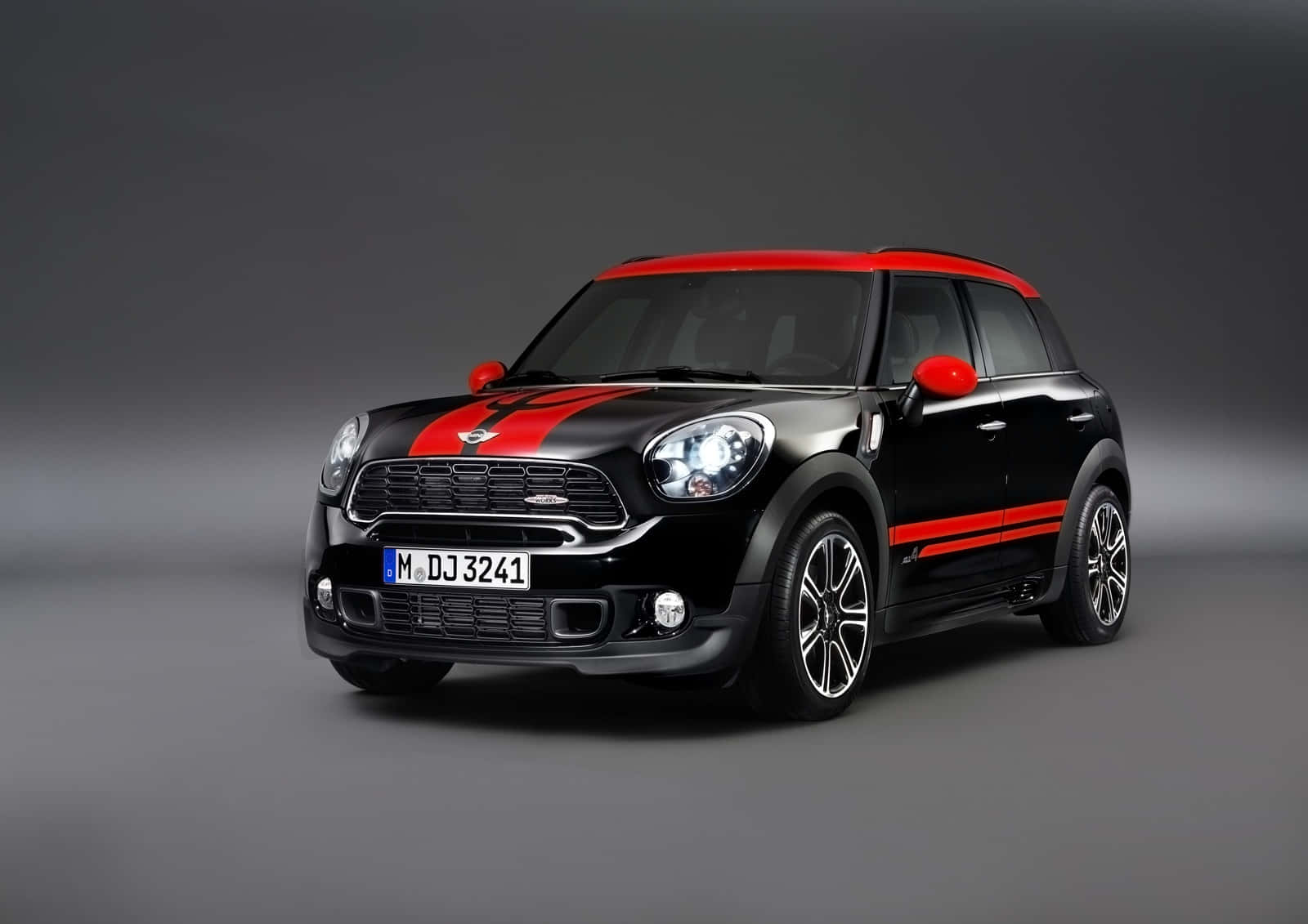 Caption: Stylish And Compact, The Mini Paceman In Dynamic Pose Wallpaper