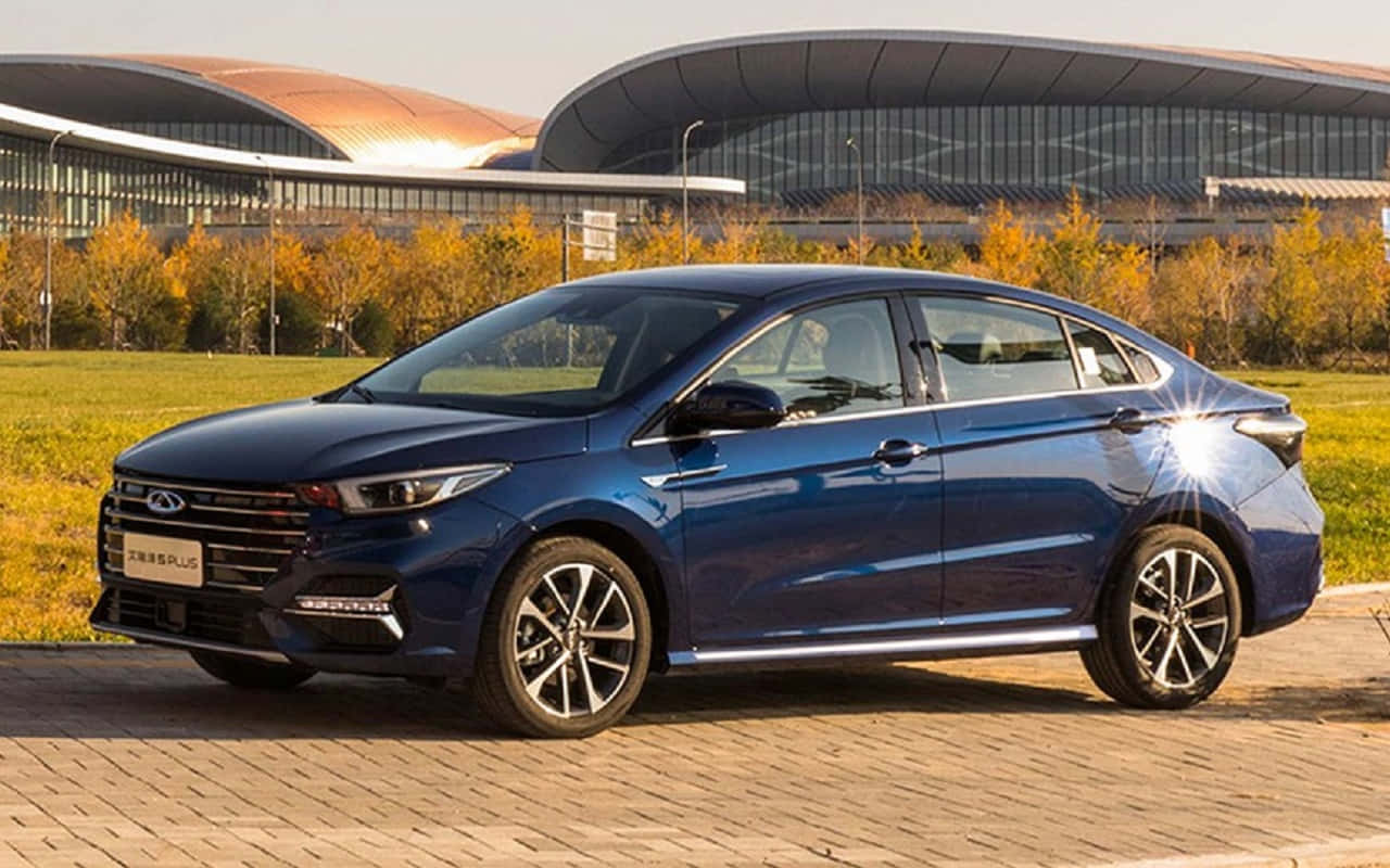 Caption: Stylish Blue Chery Arrizo 5 Parked On The Street Wallpaper