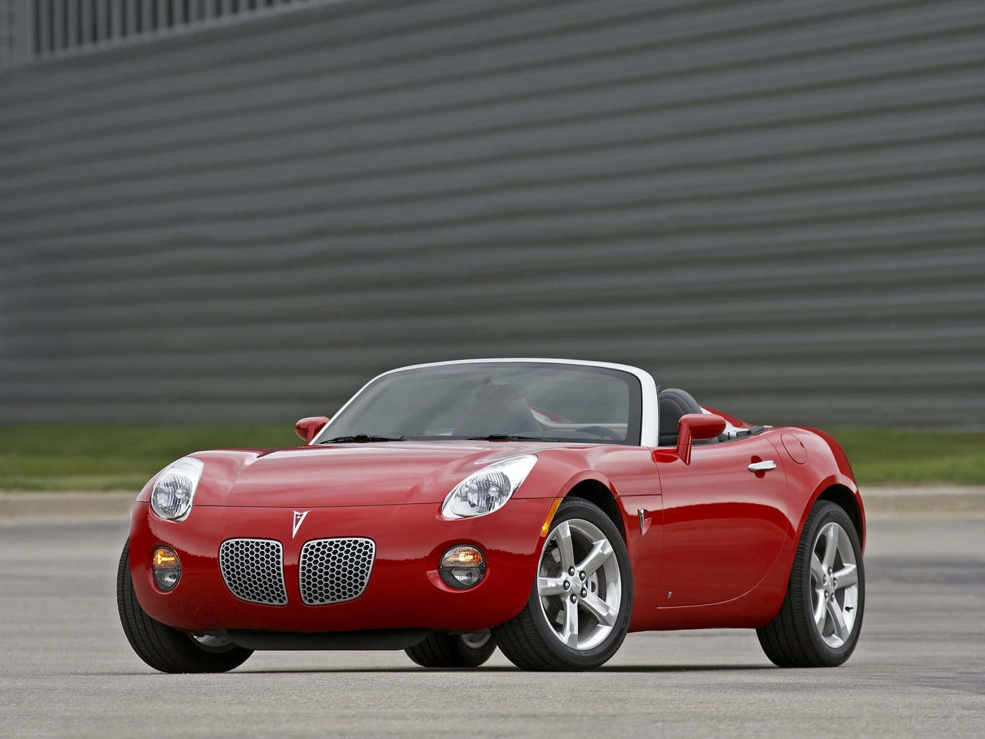 Caption: Stylish Pontiac Solstice On The Road Wallpaper