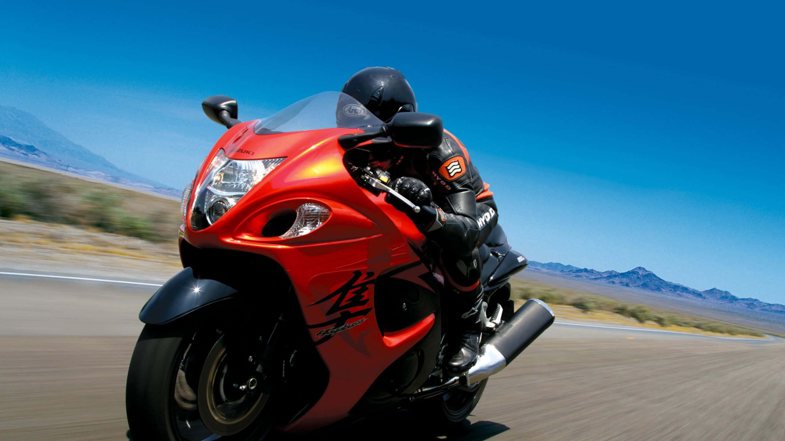 Caption: Suzuki Motorcycle - Experience The Rush Of Speed Wallpaper