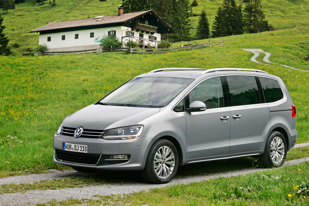 Caption: The Classic Volkswagen Sharan On A Road Trip Wallpaper