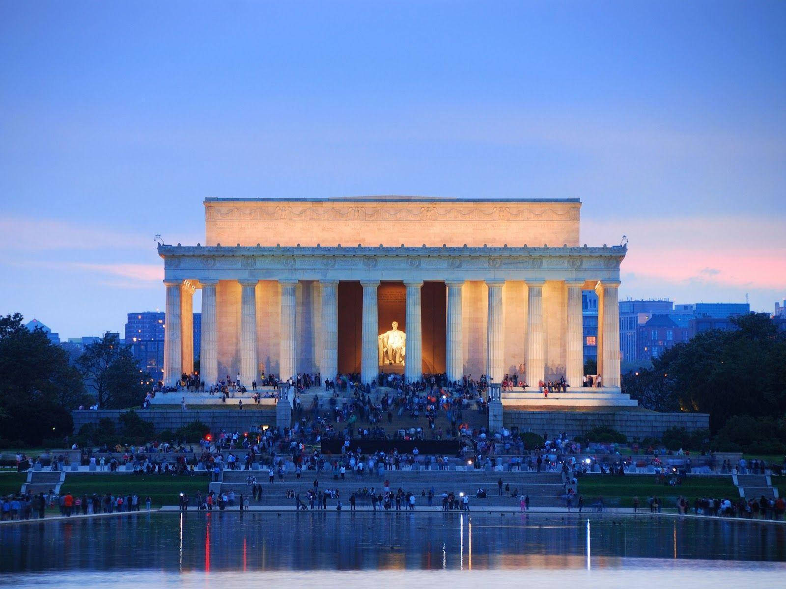 Caption: The Majestic Lincoln Memorial Under The Glowing Sky Wallpaper
