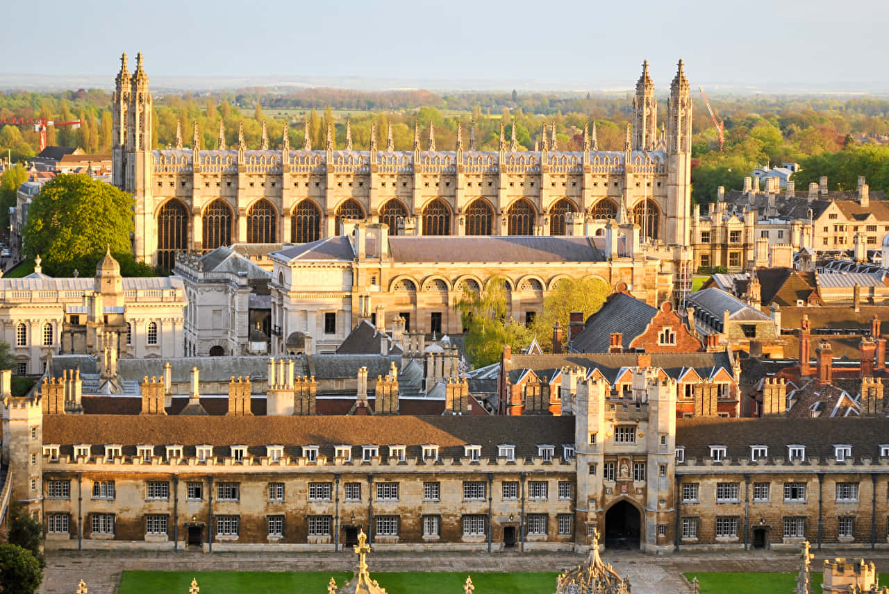 Caption: The Majestic Radcliffe Camera Against A Sky Of Blue In Oxford, United Kingdom Wallpaper