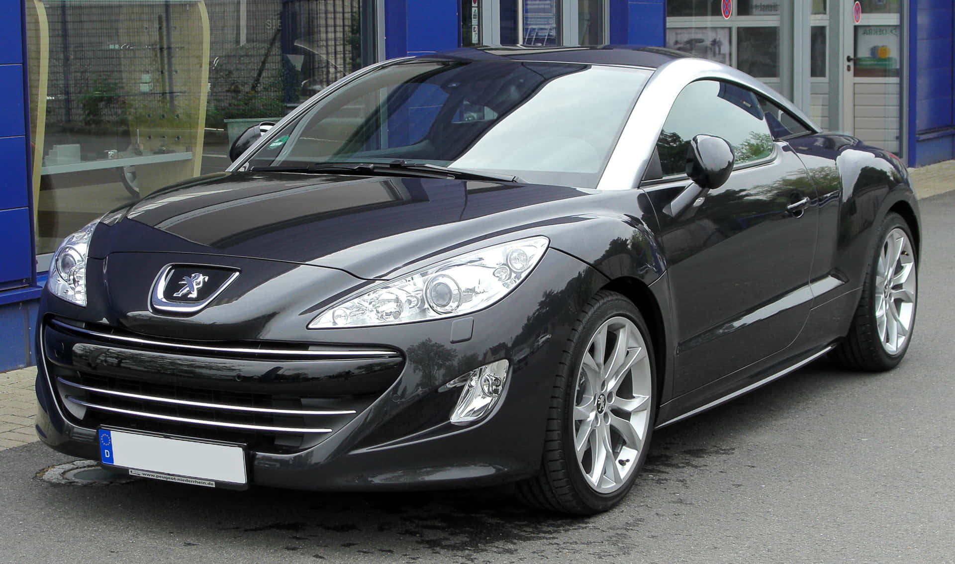 Caption: The Stylish Peugeot Rcz Luxurious Sports Coupe In Action Wallpaper