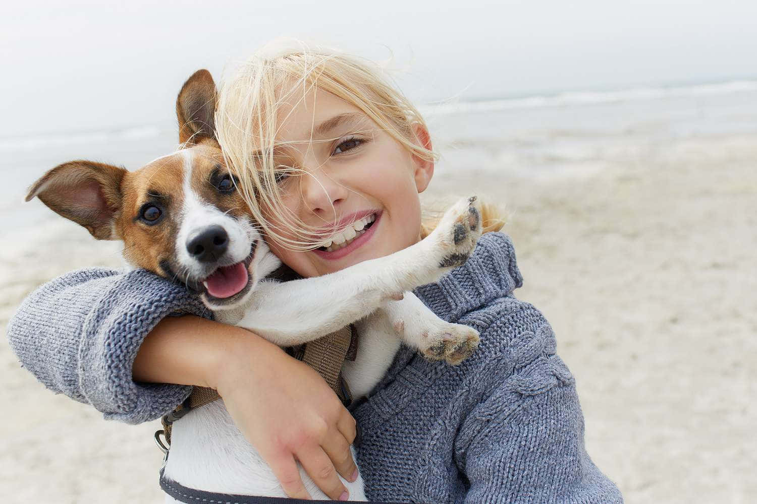 Caption: Unconditional Love - Girl Hugging Her Dog Wallpaper