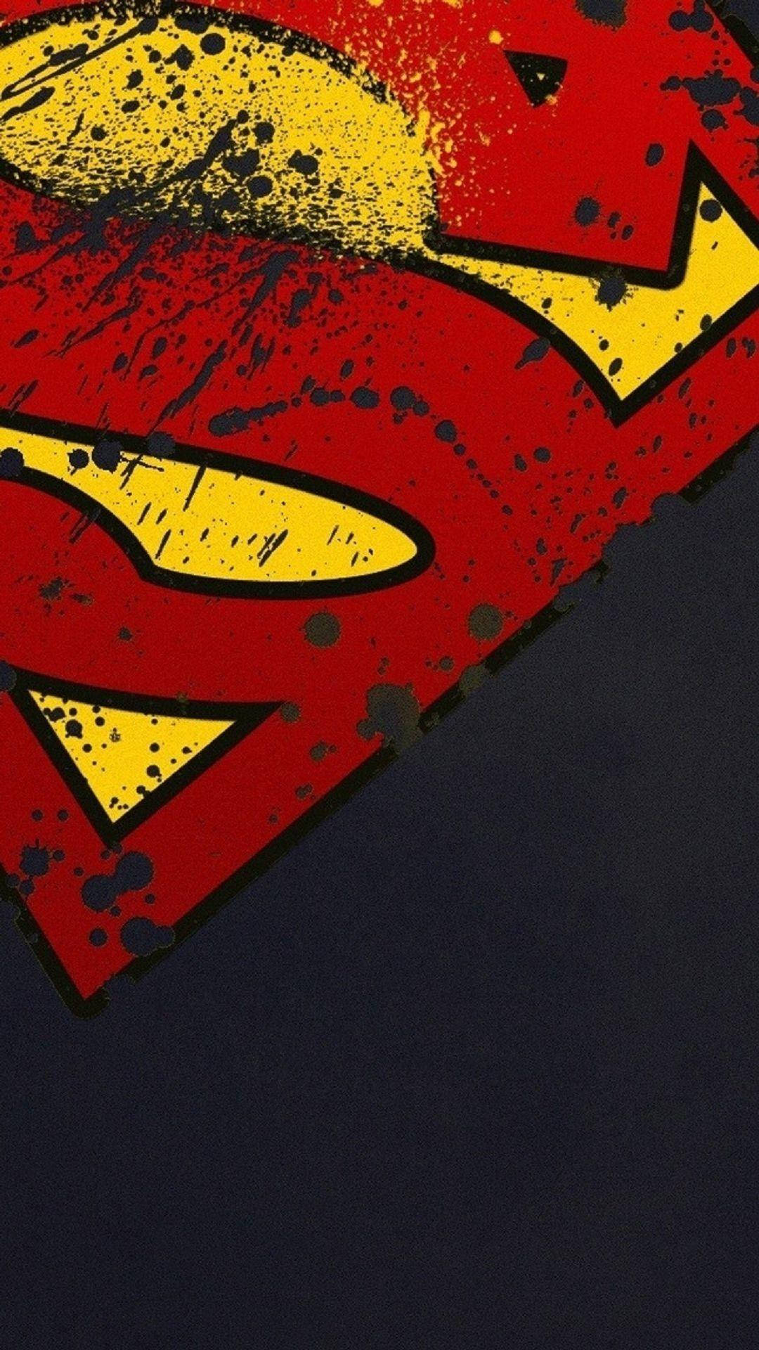 Caption: Valiant Superman Symbol On Iphone Background Wallpaper