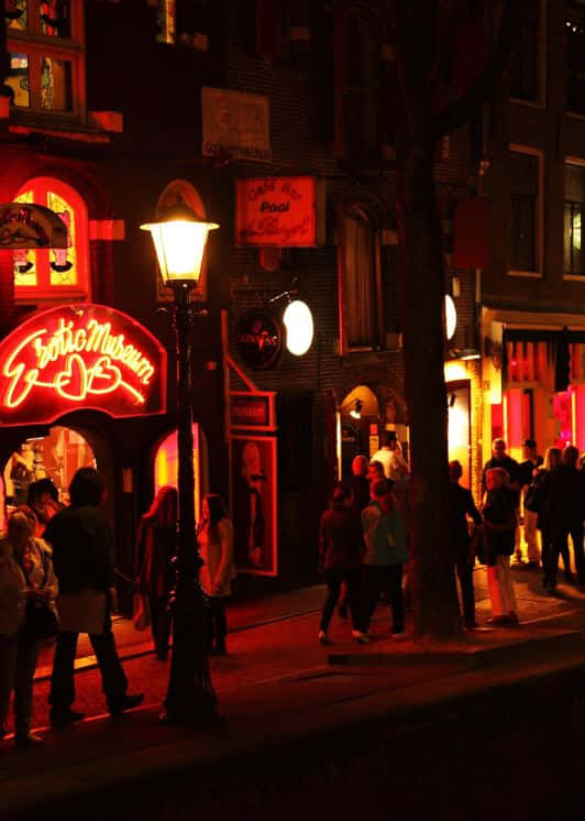Caption: Vibrant Nightlife Of The Red Light District Wallpaper