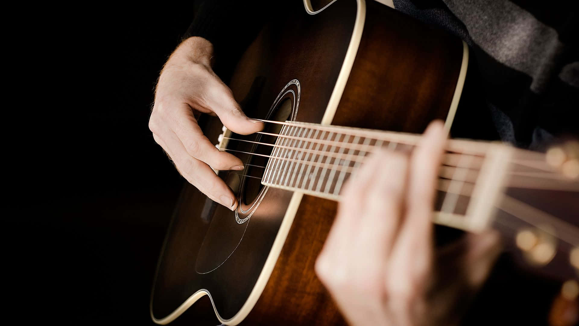 Caption: Vibrant Sounds - A Classic Guitar Set Against A Colorful Abstract Background