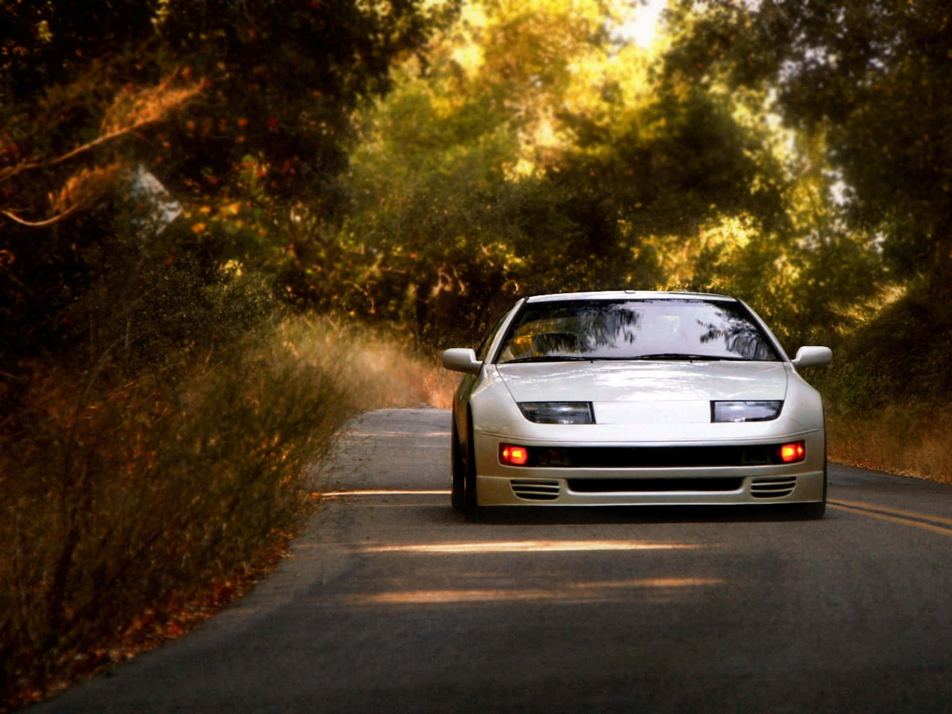 Caption: Vintage Nissan 300zx Roaring On The Road Wallpaper