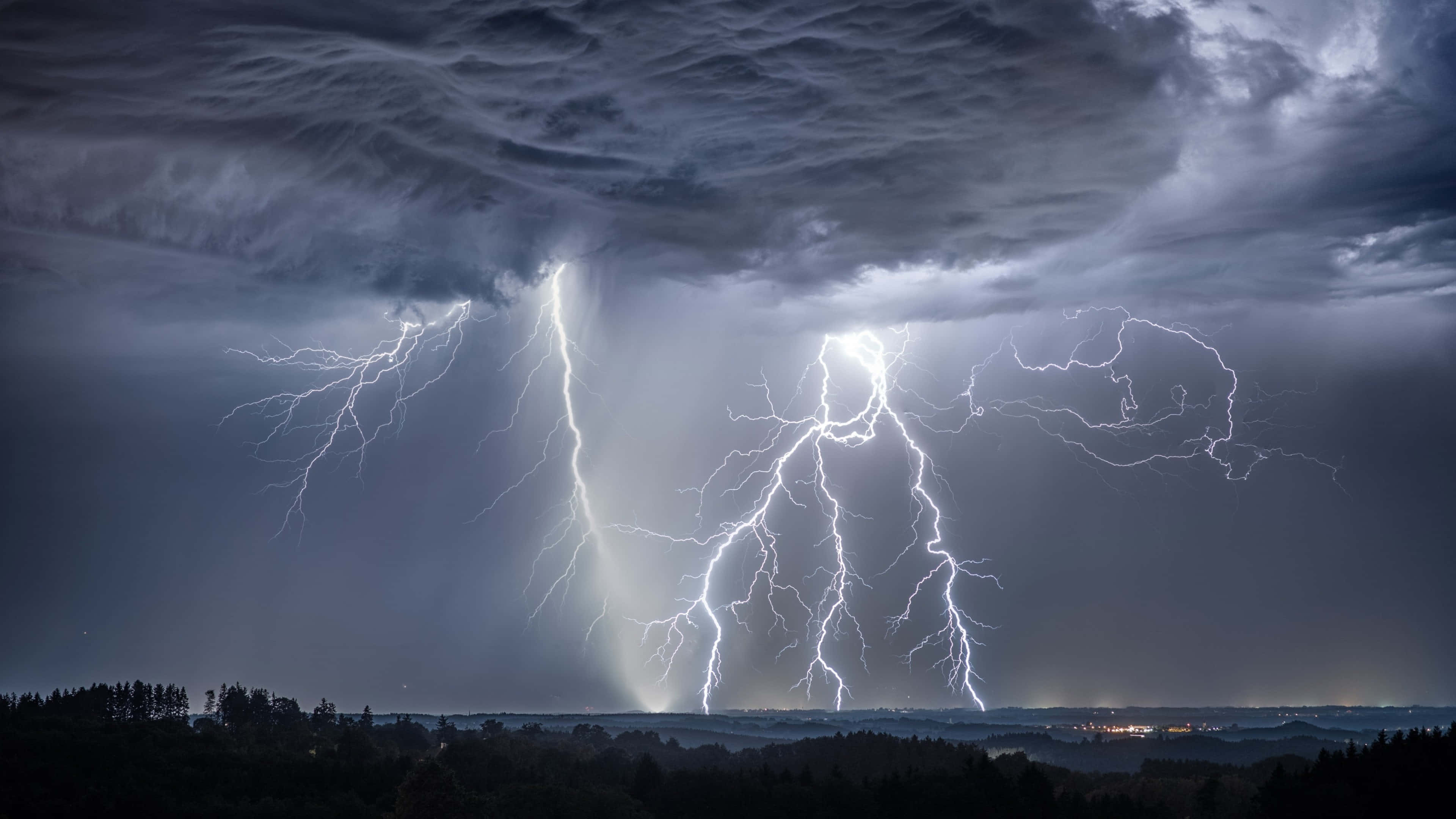 Captivating 4k Display Of A Lightning Storm Wallpaper