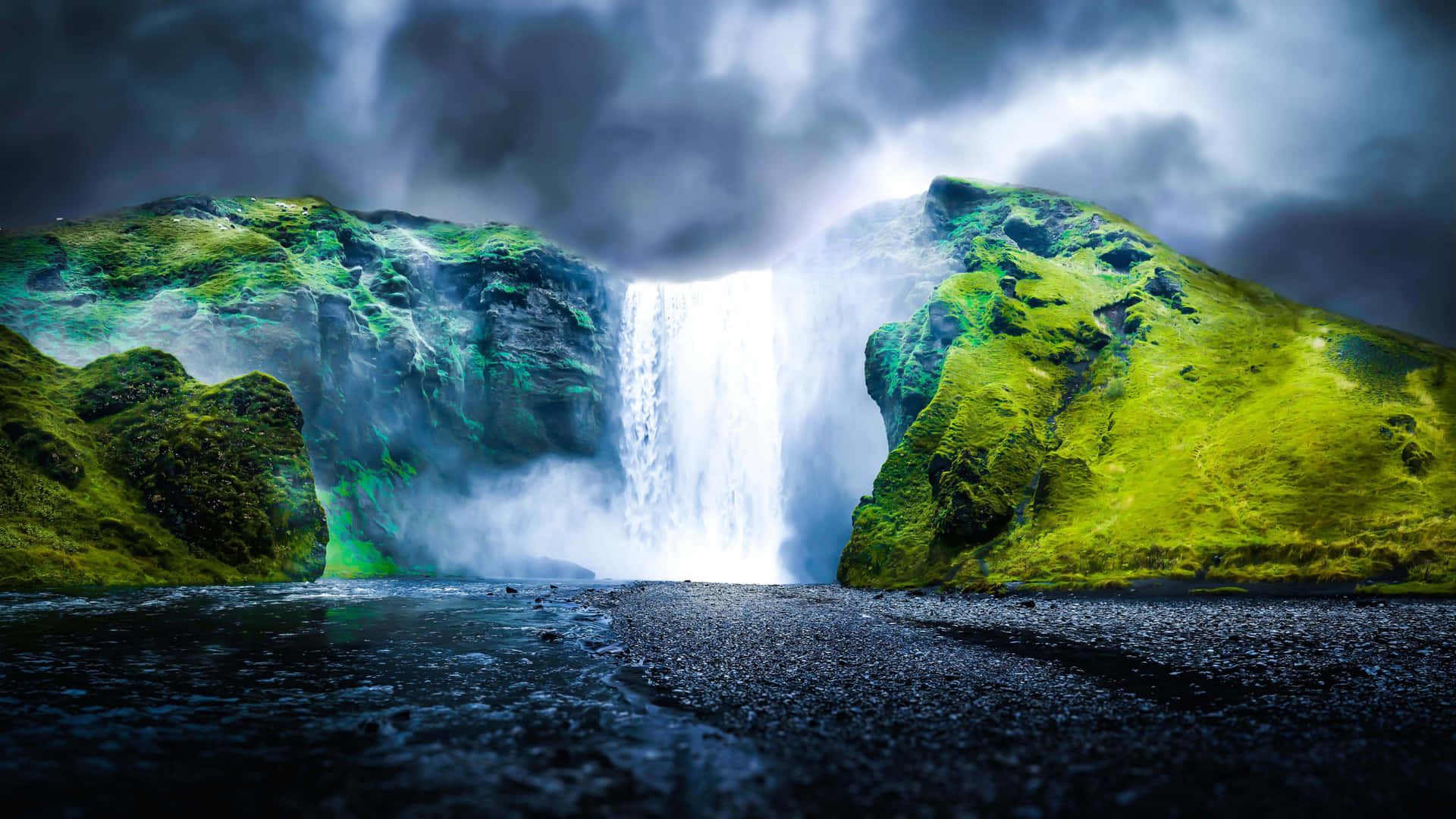 Captivating 4k Image Of A Majestic Waterfall Wallpaper