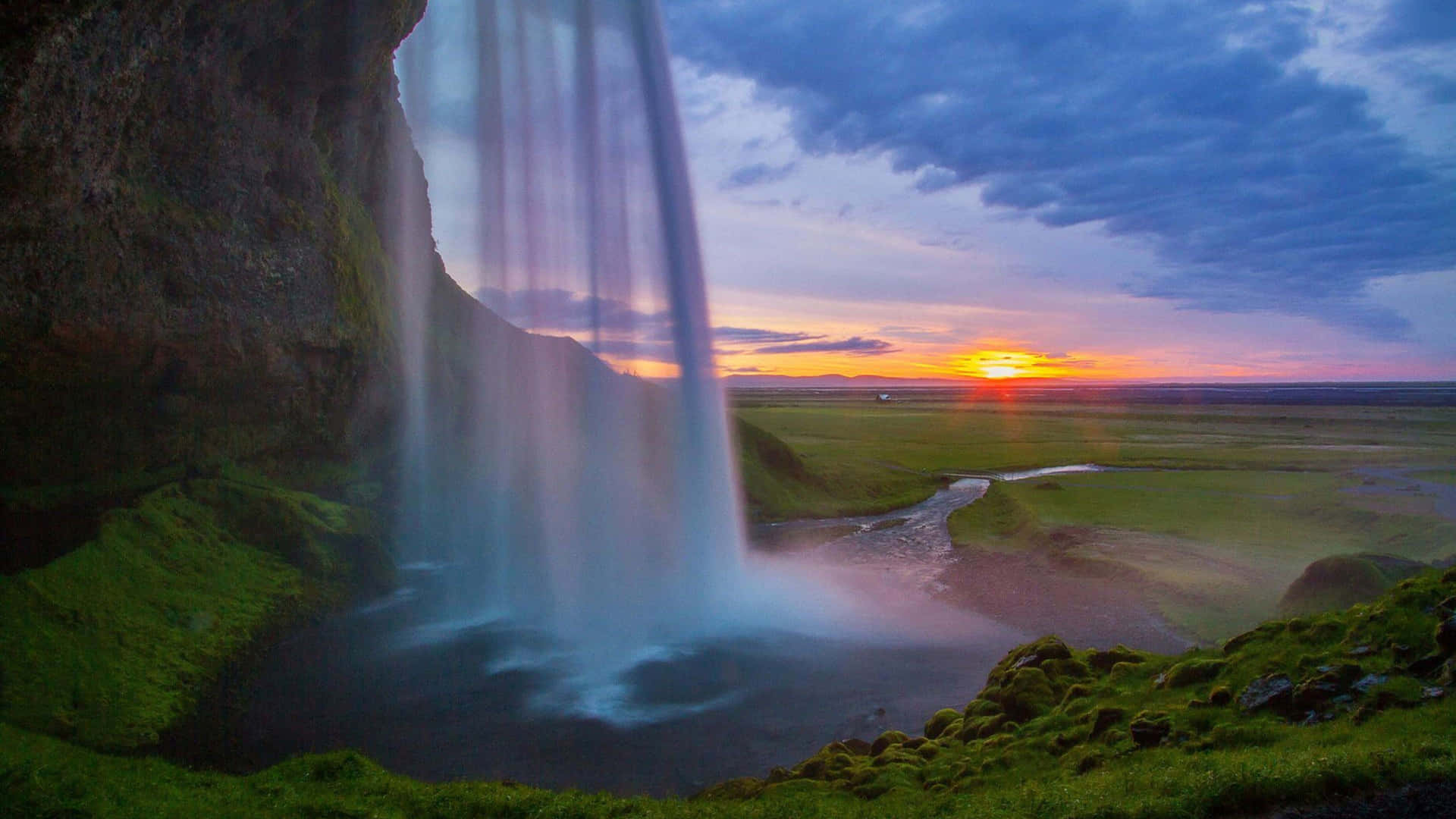 Captivating 4k Waterfall Flowing With Power And Grace Wallpaper
