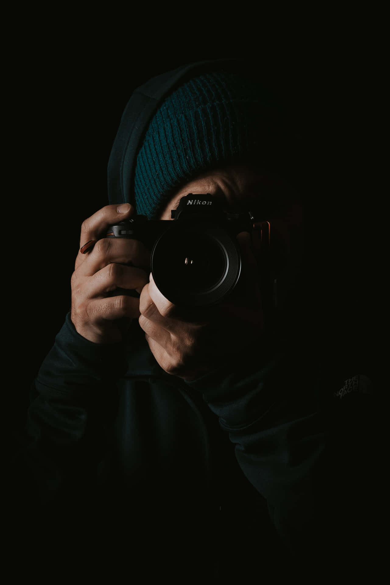 Captivating Dslr Camera On A Dark Blurred Background
