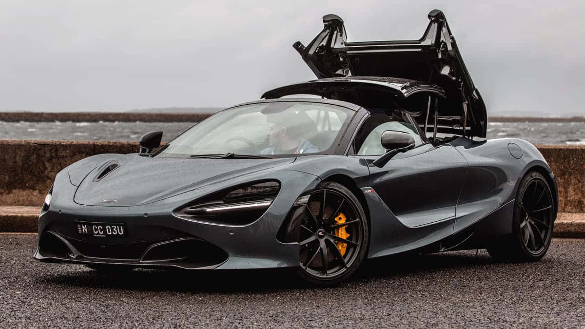 Captivating Mclaren 720s Spider In Chic Blue Wallpaper