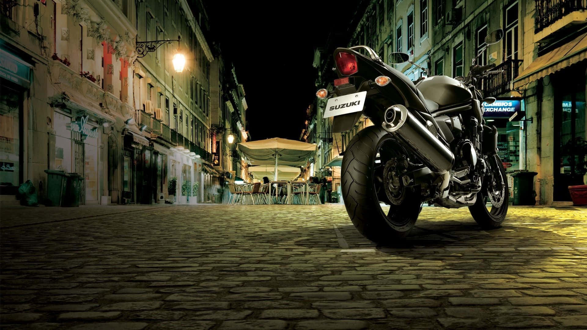 Captivating Suzuki Motorcycle In Action Wallpaper