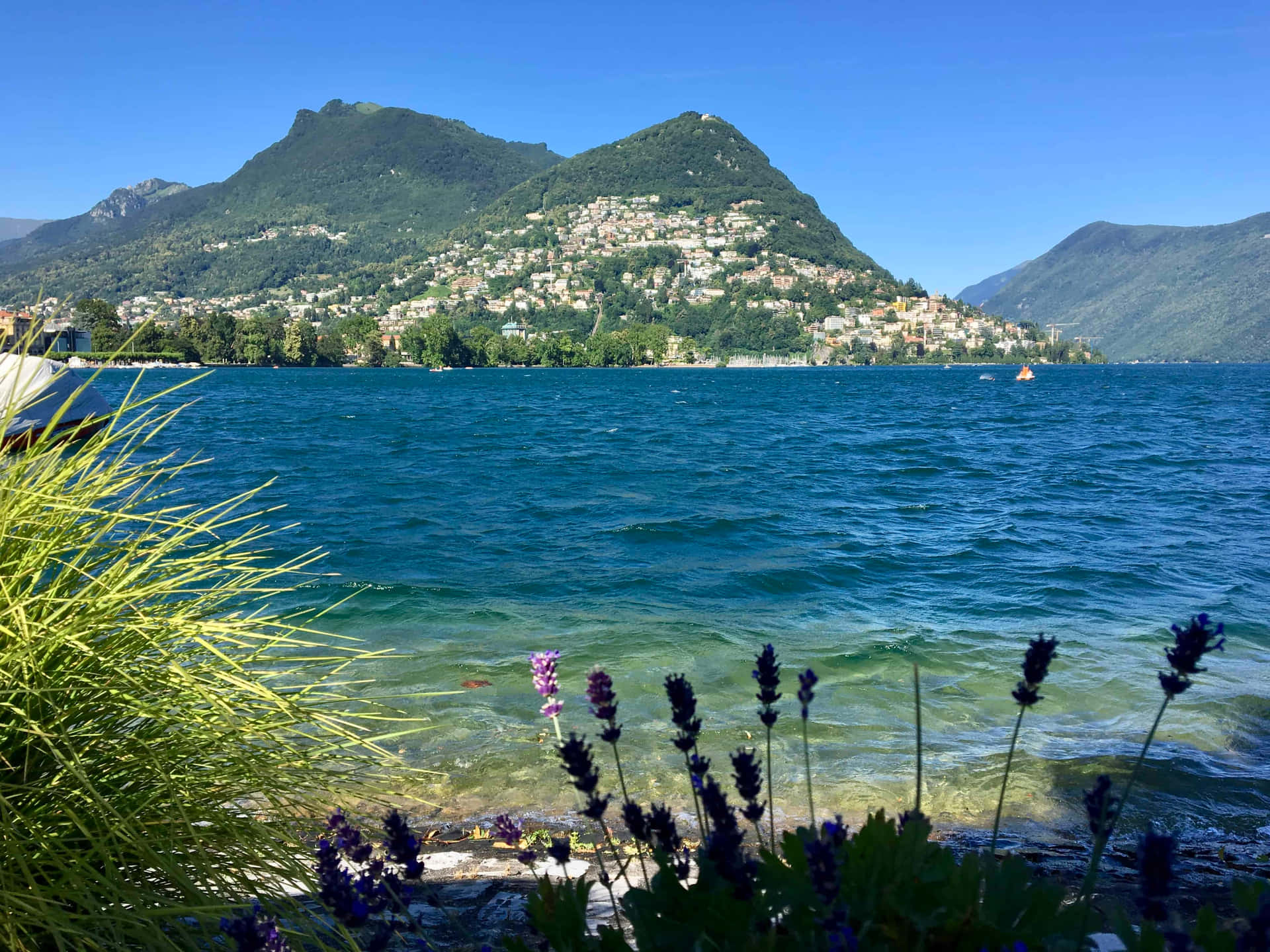 Captivating View Of Lugano Lake In Switzerland Wallpaper