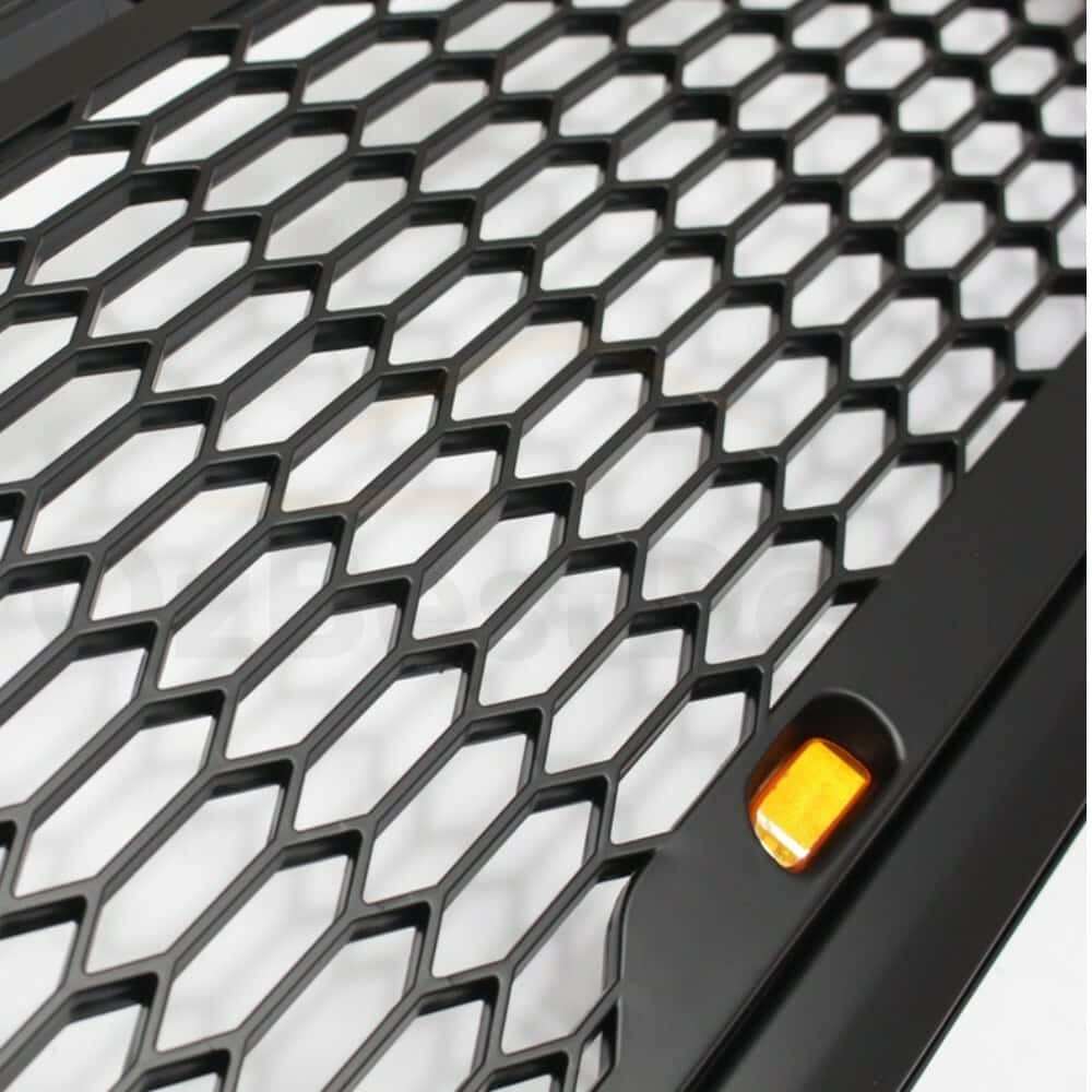 Stunning Close-Up of a Car Grill Wallpaper