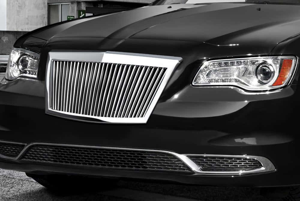 Close-up of a glossy car grill on a luxury automobile Wallpaper