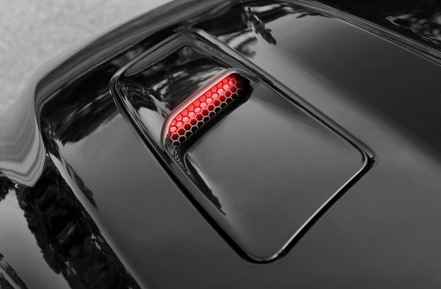 Close-up view of a sleek car hood Wallpaper