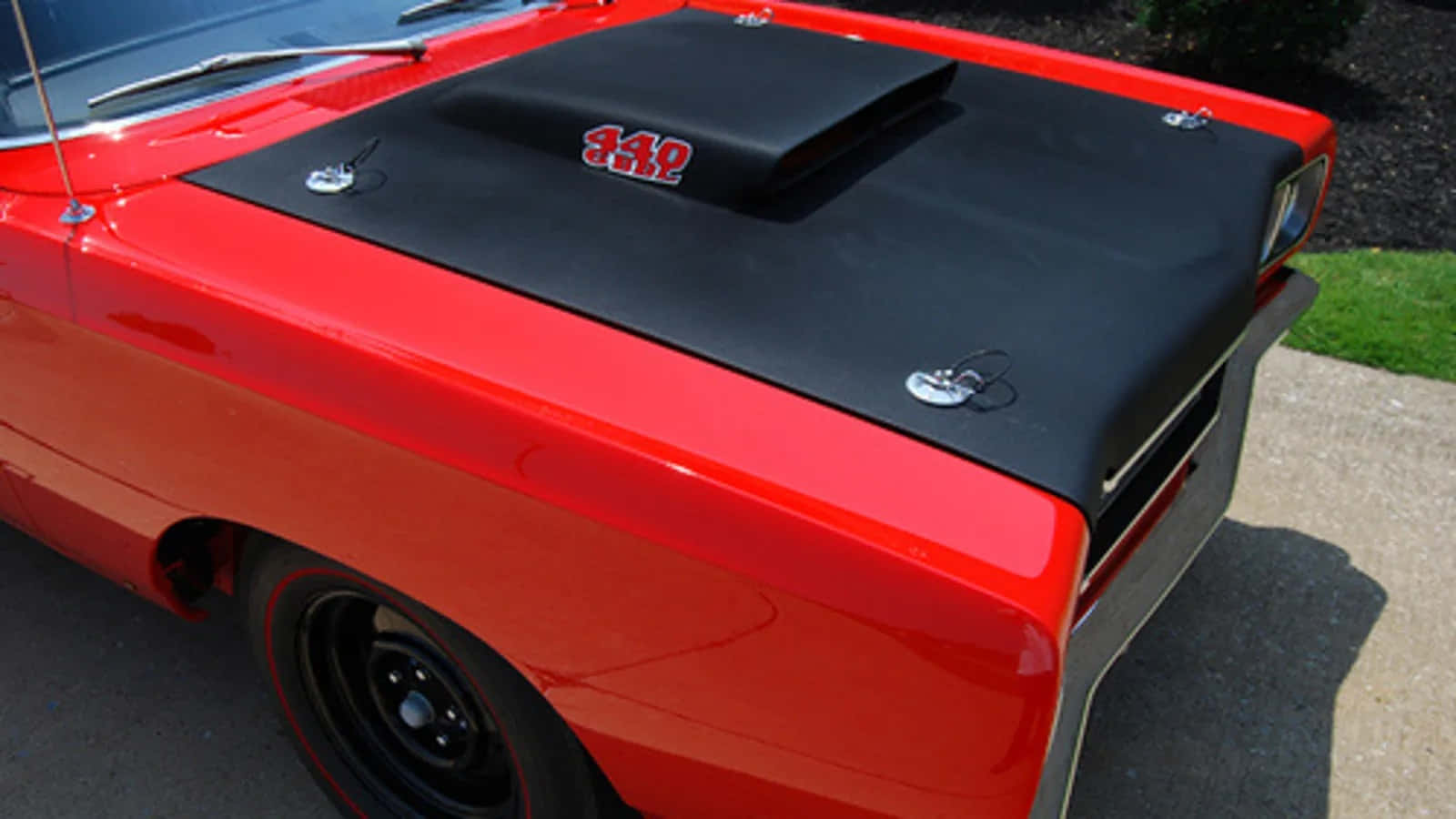 Sleek car hood with eye-catching design Wallpaper