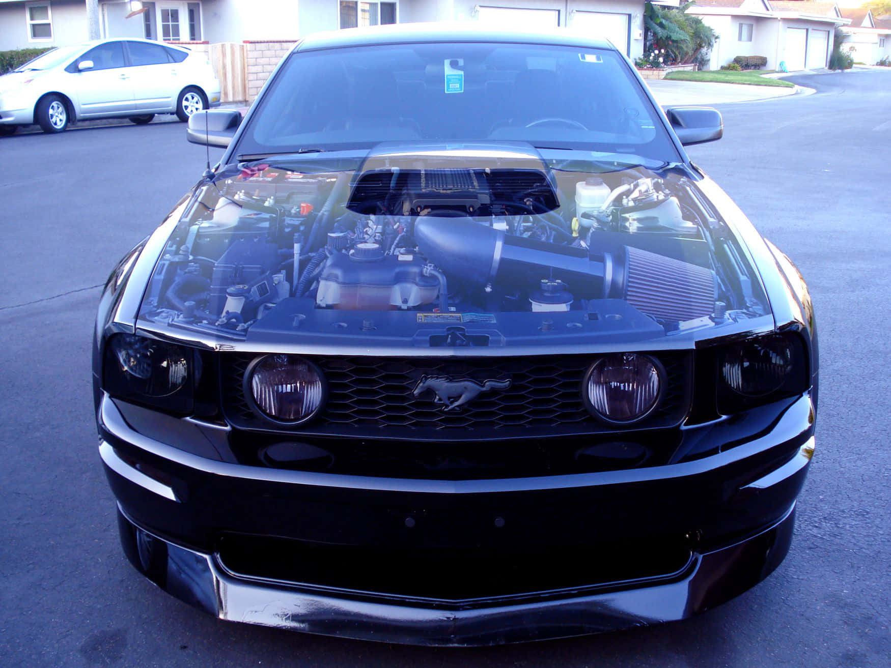 Sleek car hood reflecting the skyline Wallpaper