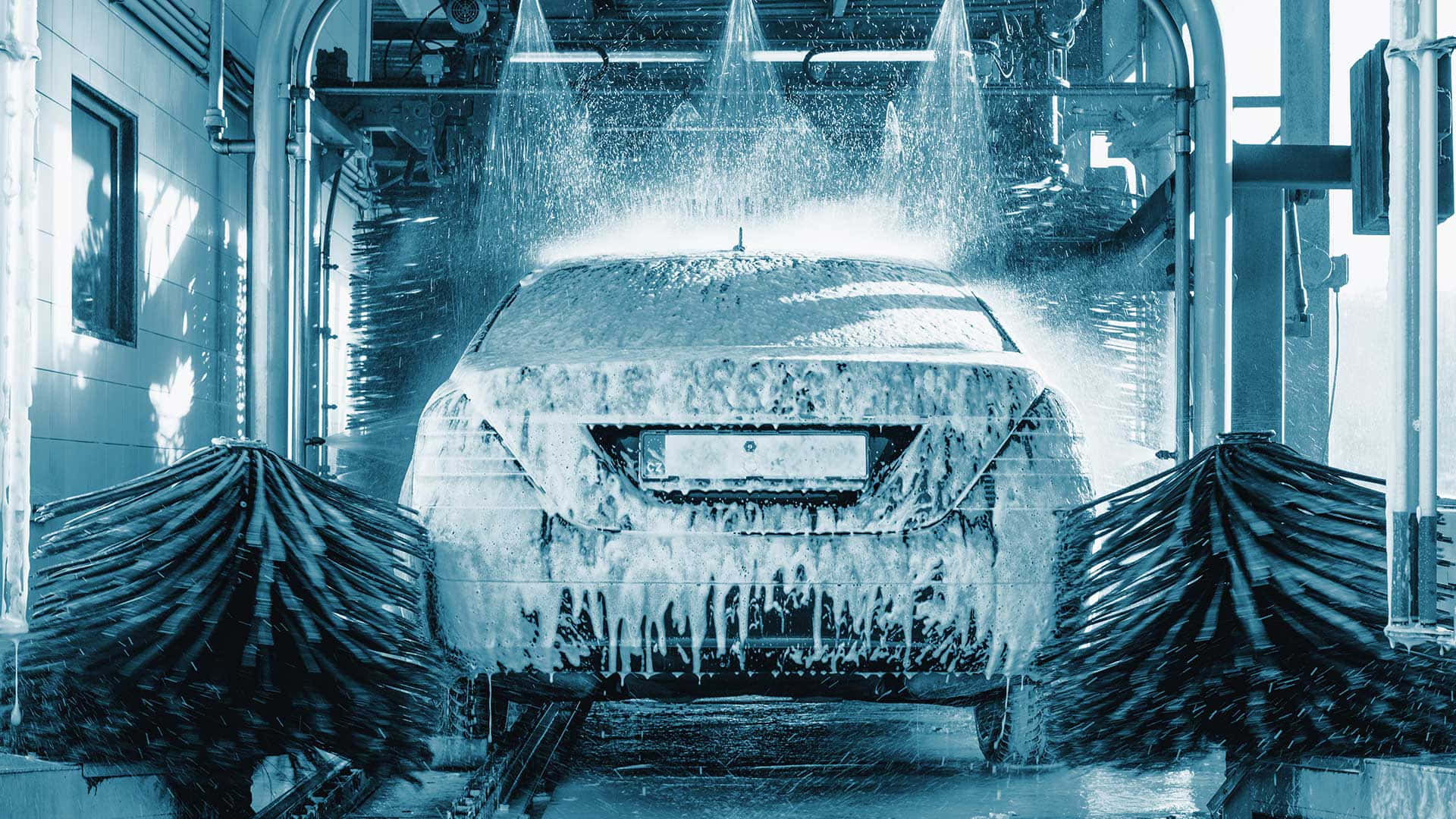 A Car Is Being Washed In A Car Wash
