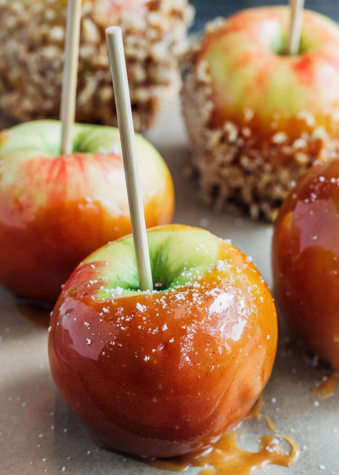 Tempting Caramel Apples with a Variety of Toppings Wallpaper