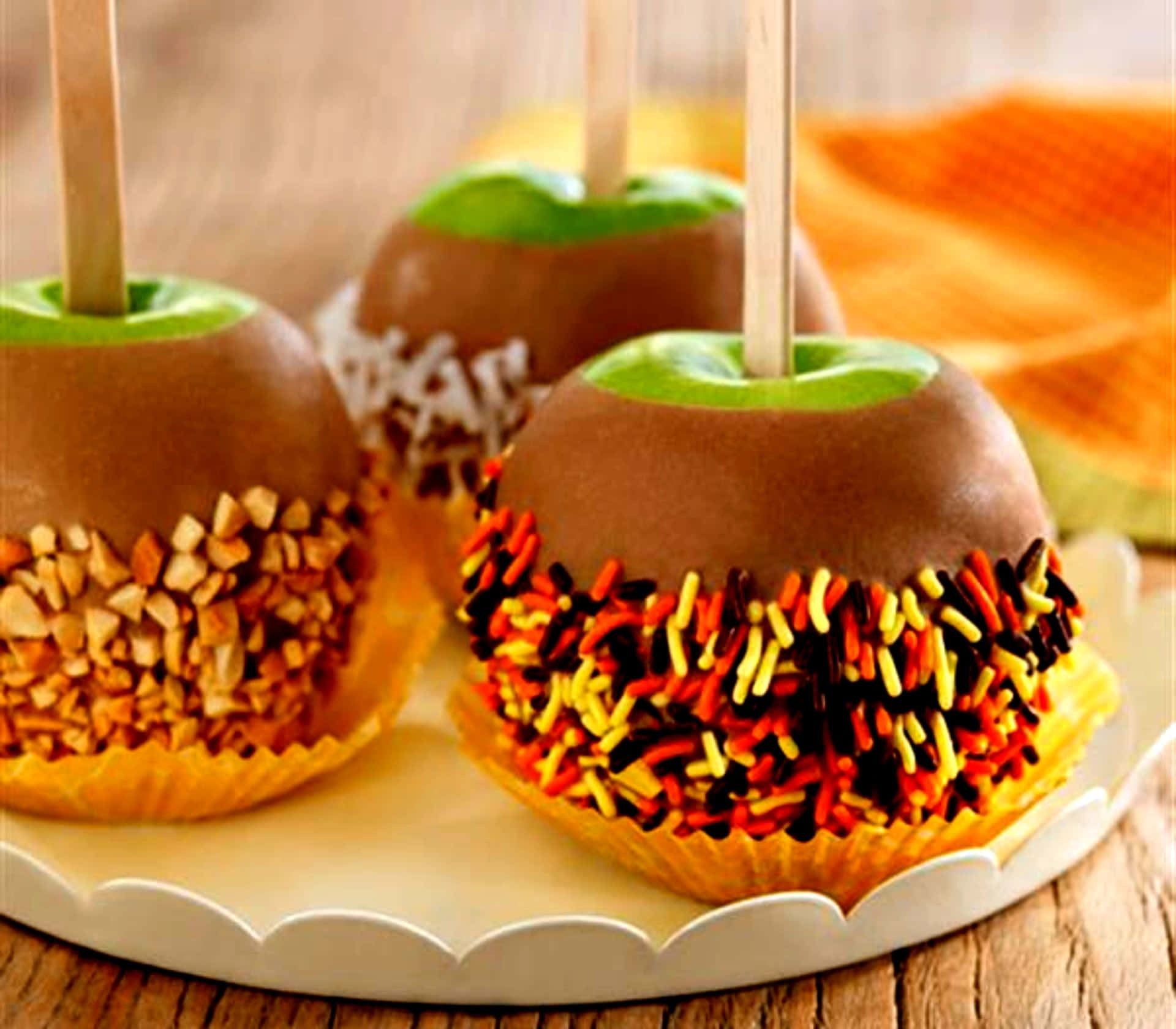 Delectable Caramel Apples with Chopped Nuts Wallpaper