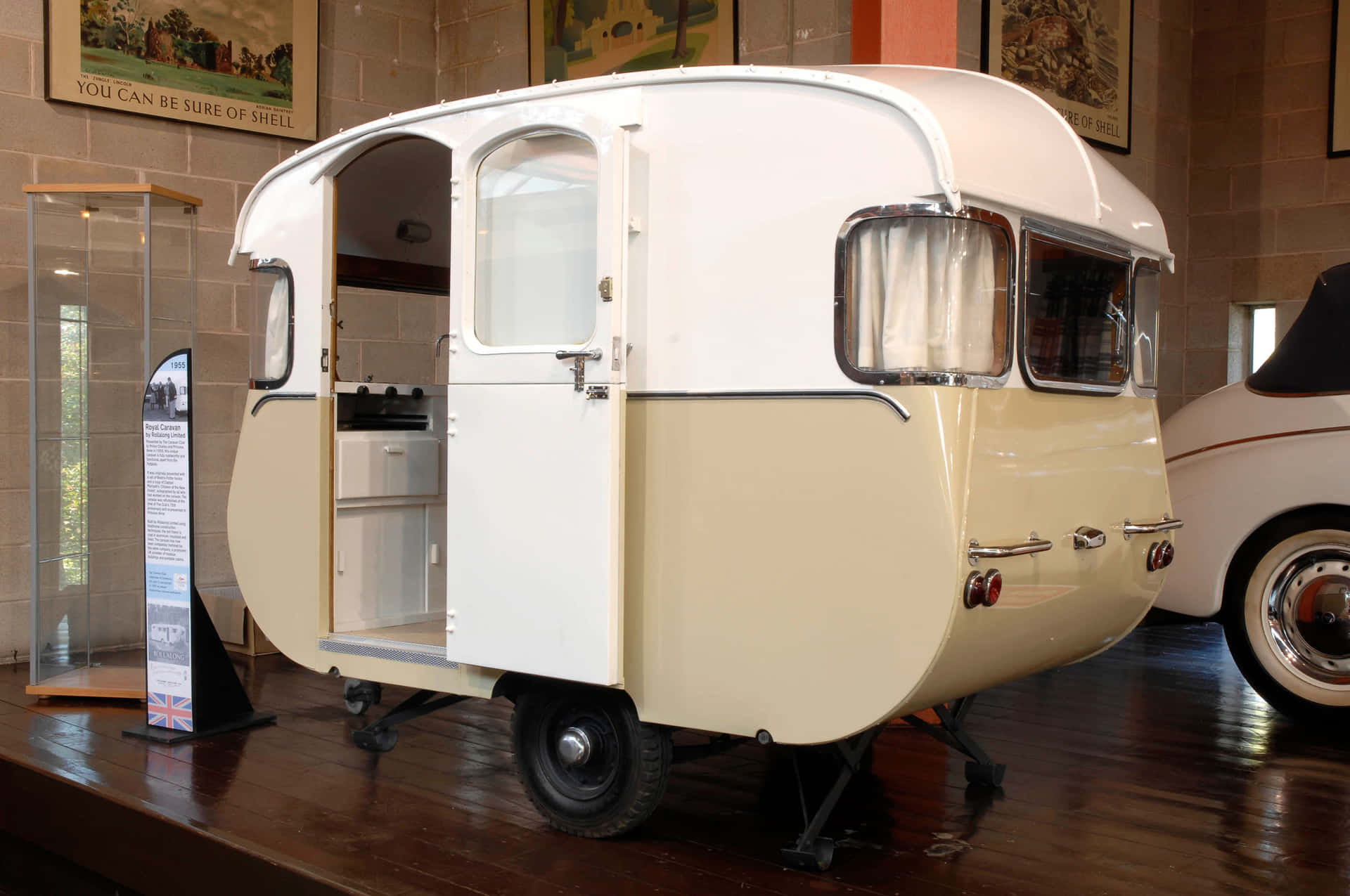 A Small White And Yellow Camper