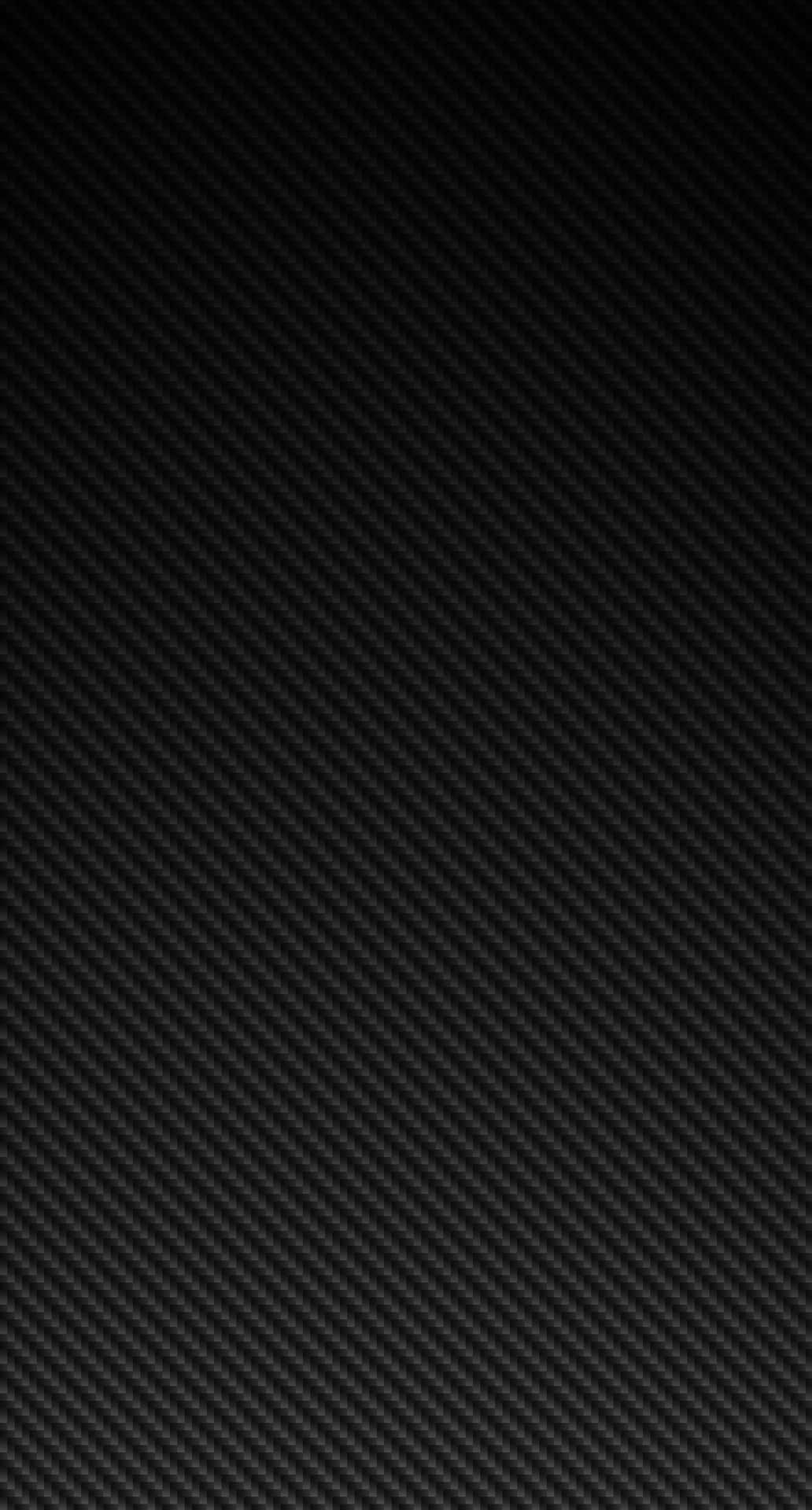 A Black Carbon Fiber Background With A Black Background Wallpaper