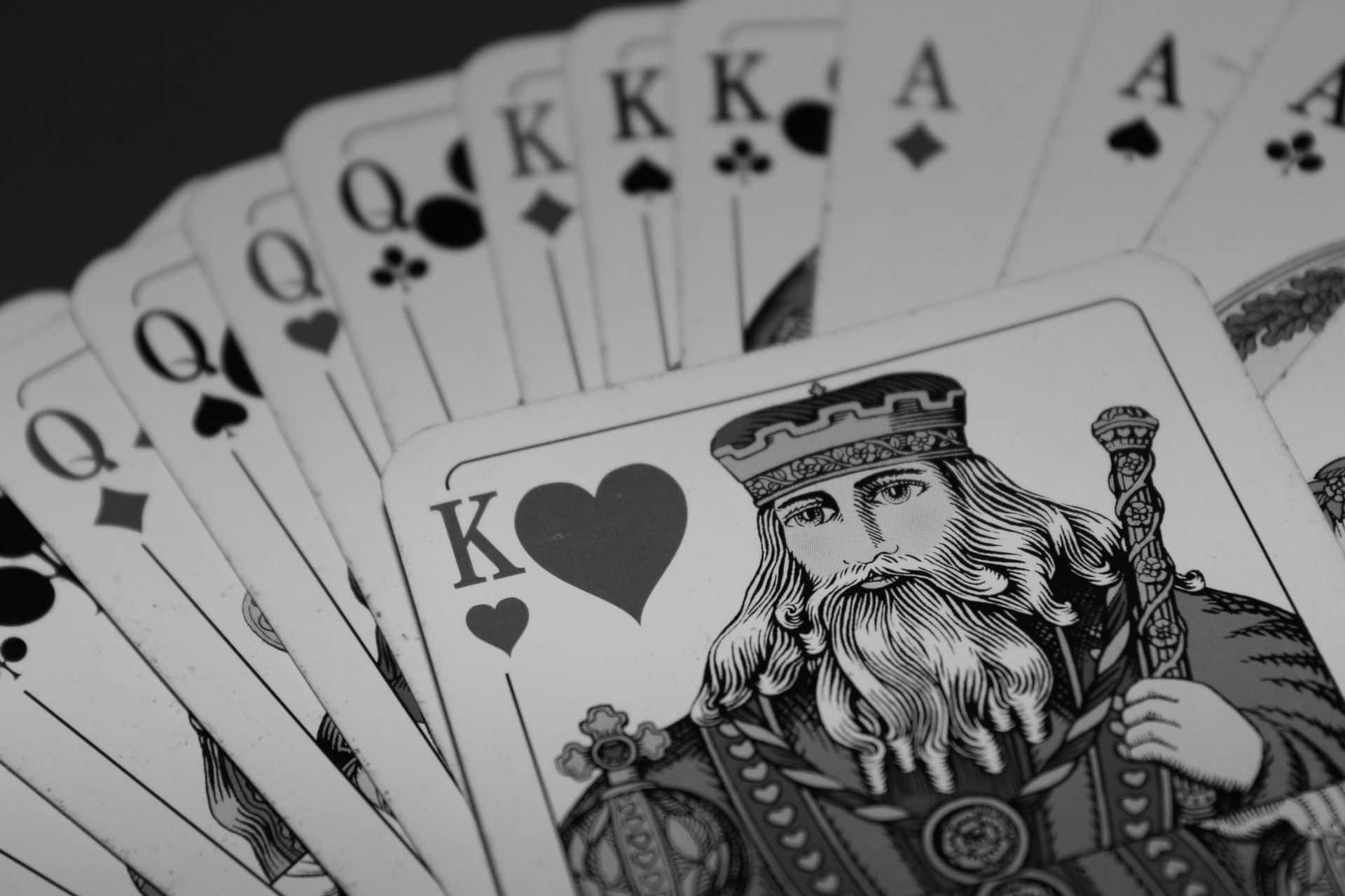 A gripping card game session with a royal flush hand Wallpaper